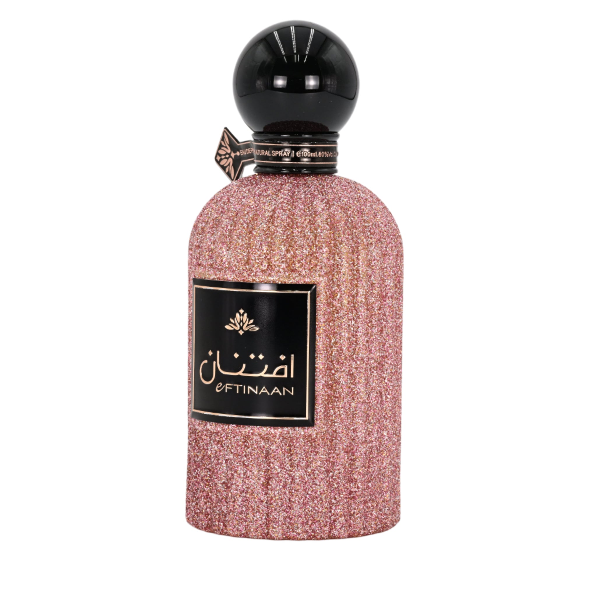 Perfume bottle with glittery pink body and black cap on a white background