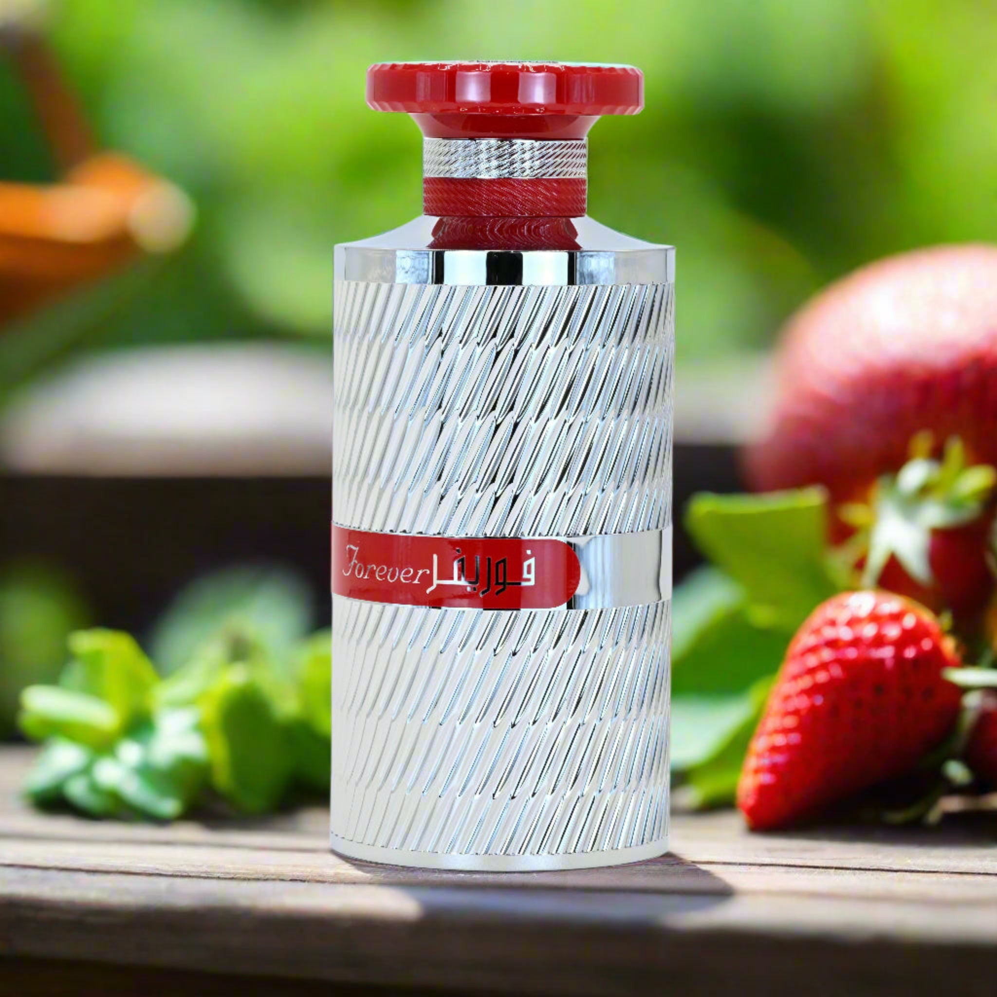 Cylindrical container with red top and white body on a wooden surface with strawberries and greenery in the background