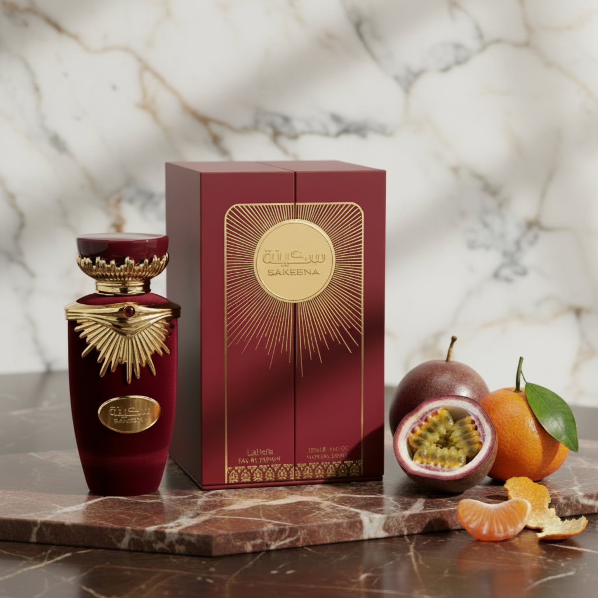Red and gold perfume bottle with matching box on a white background