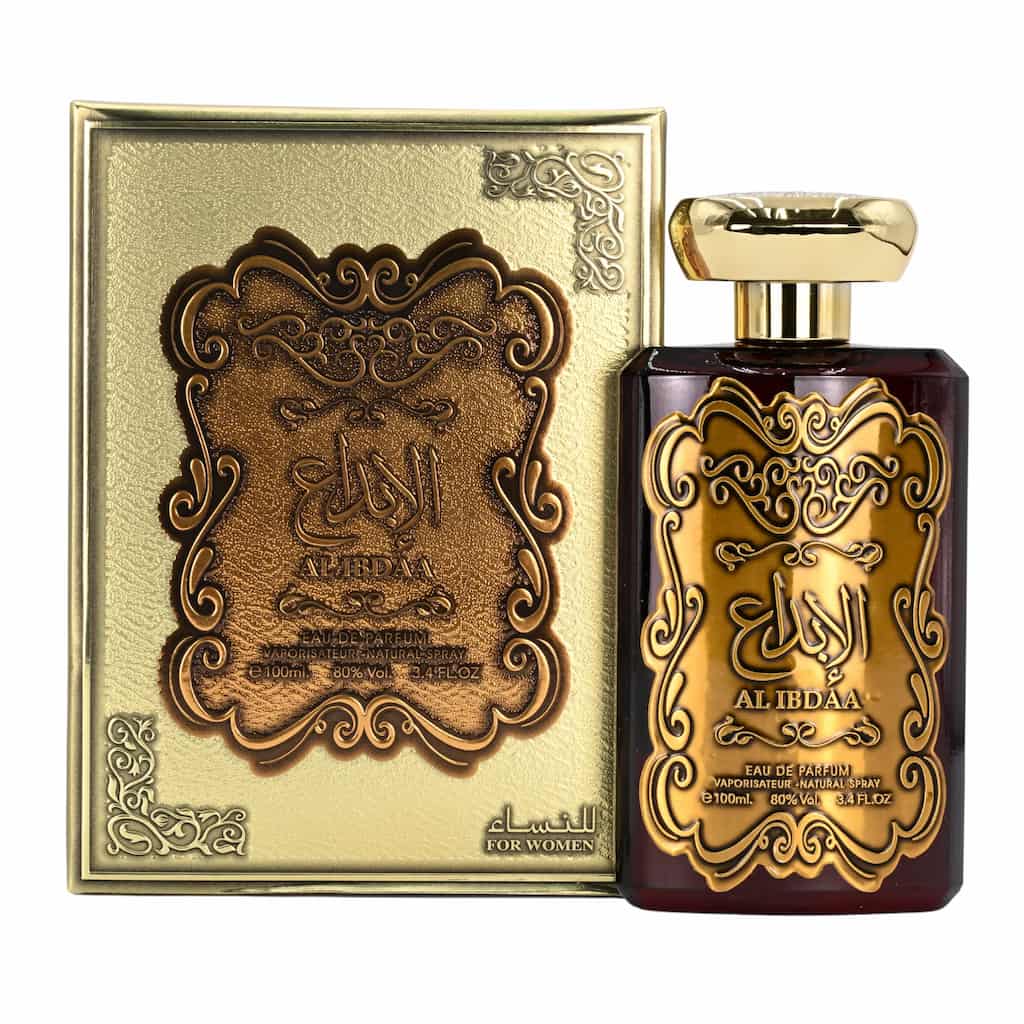 Al Ibdaa perfume bottle and packaging with gold and brown design on a white background