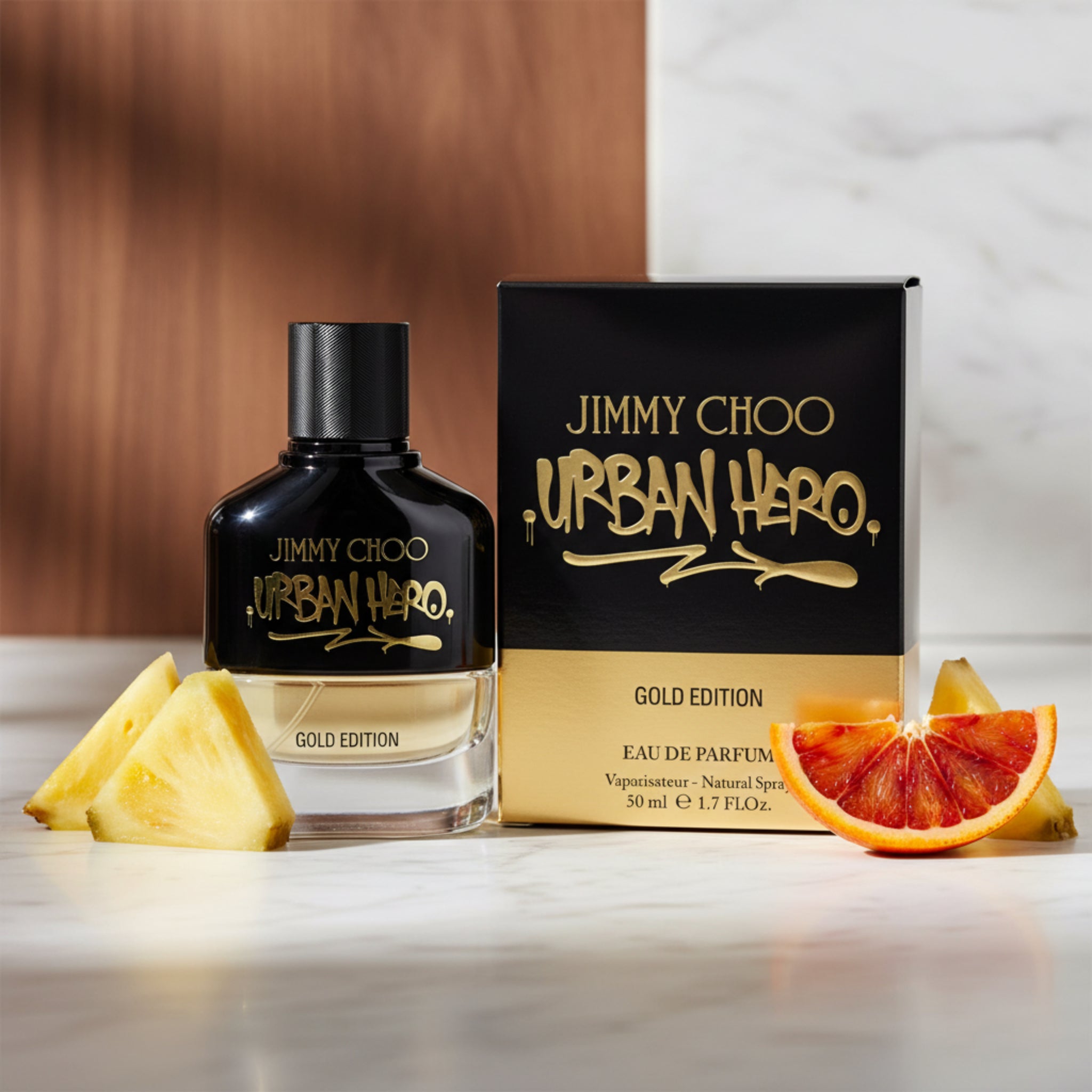 Jimmy Choo Urban Hero Gold Edition perfume bottle and packaging on a white background