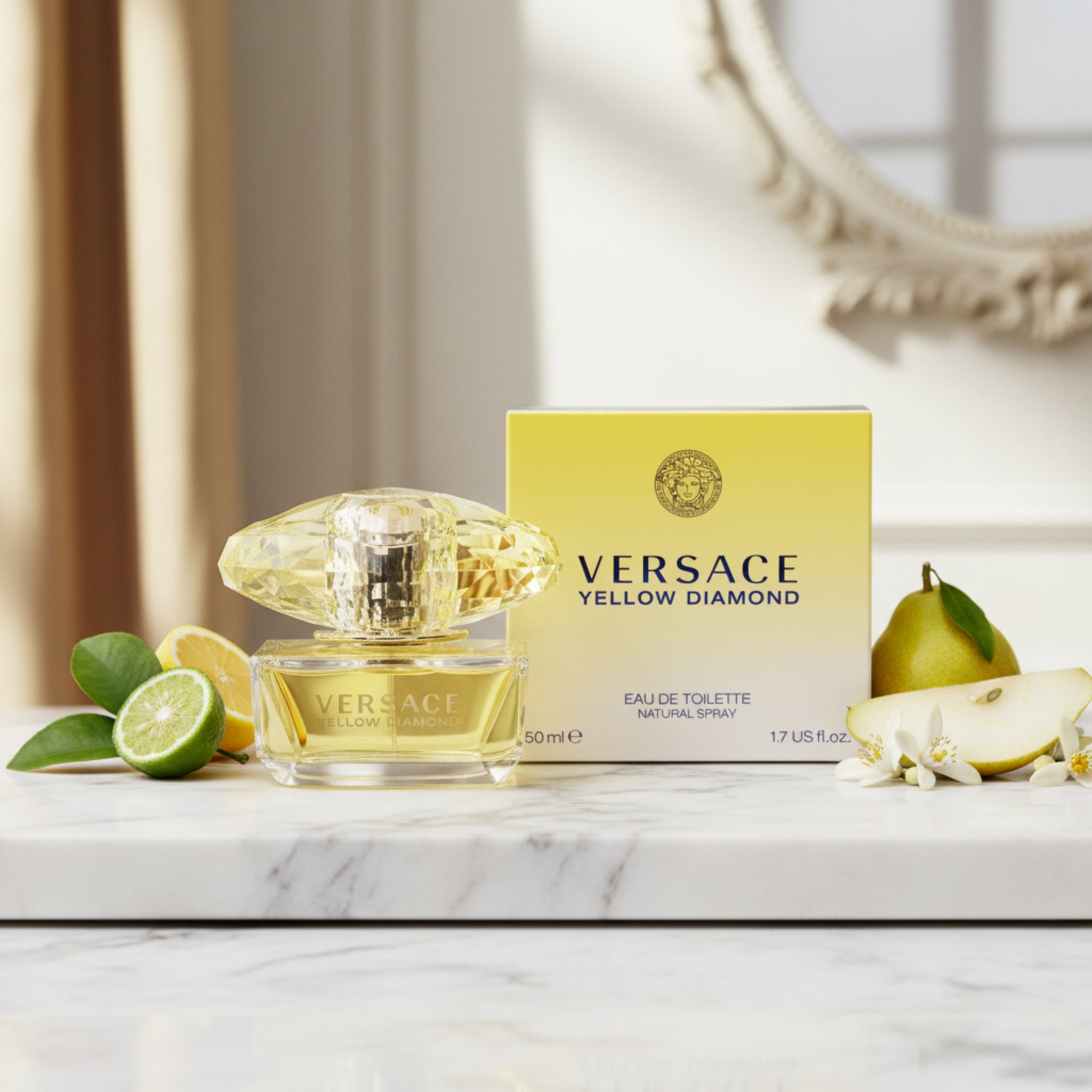 Versace Yellow Diamond perfume bottle and packaging on a marble surface with fruits and leaves.