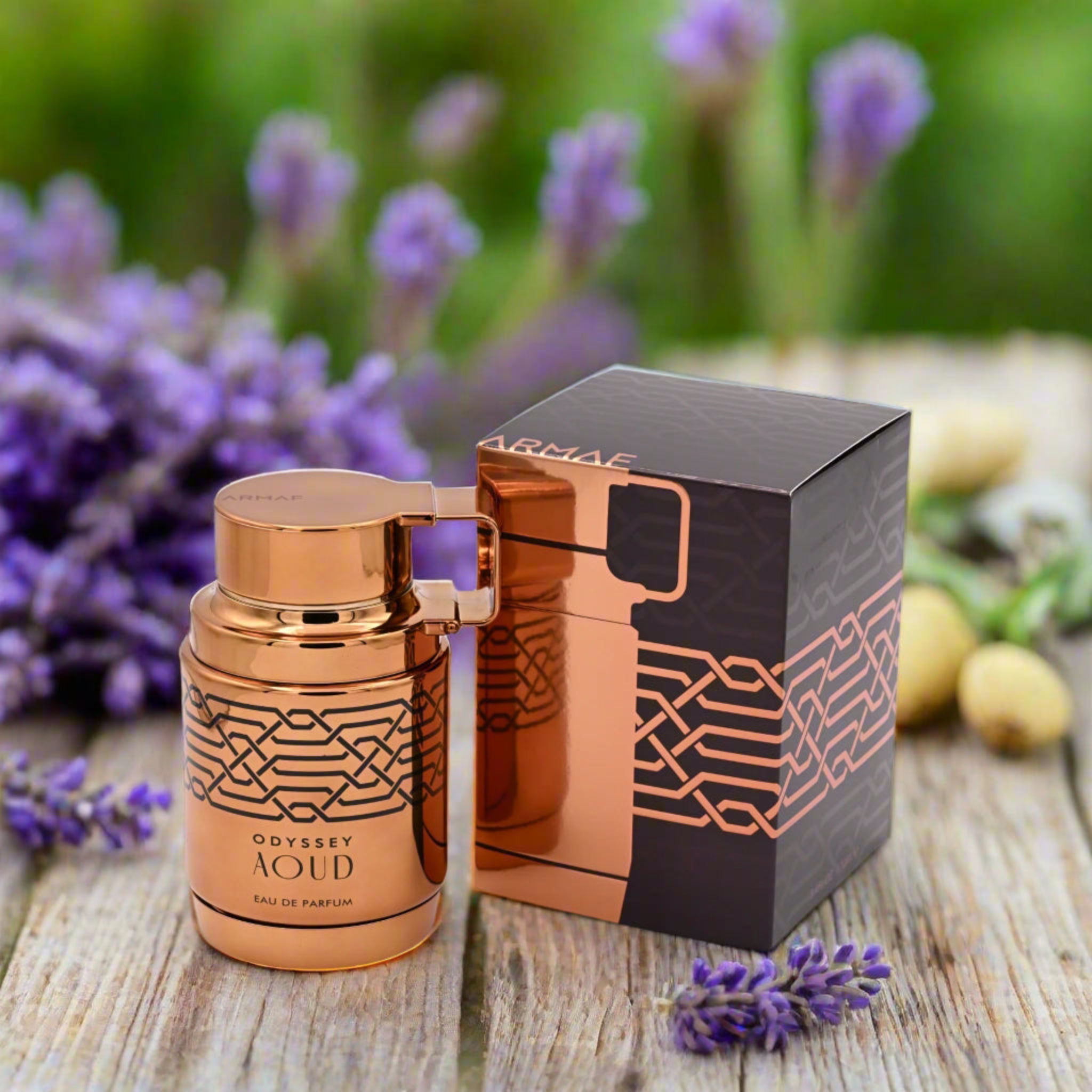 Copper-colored perfume bottle with matching box on a white background