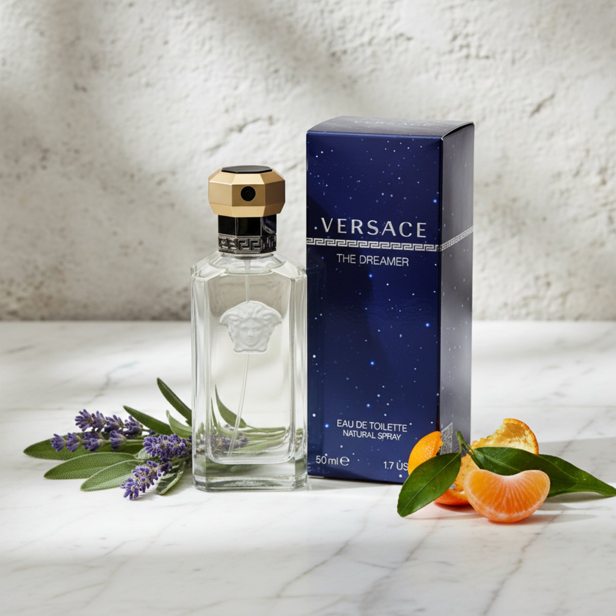 Versace The Dreamer perfume bottle and packaging on a white background