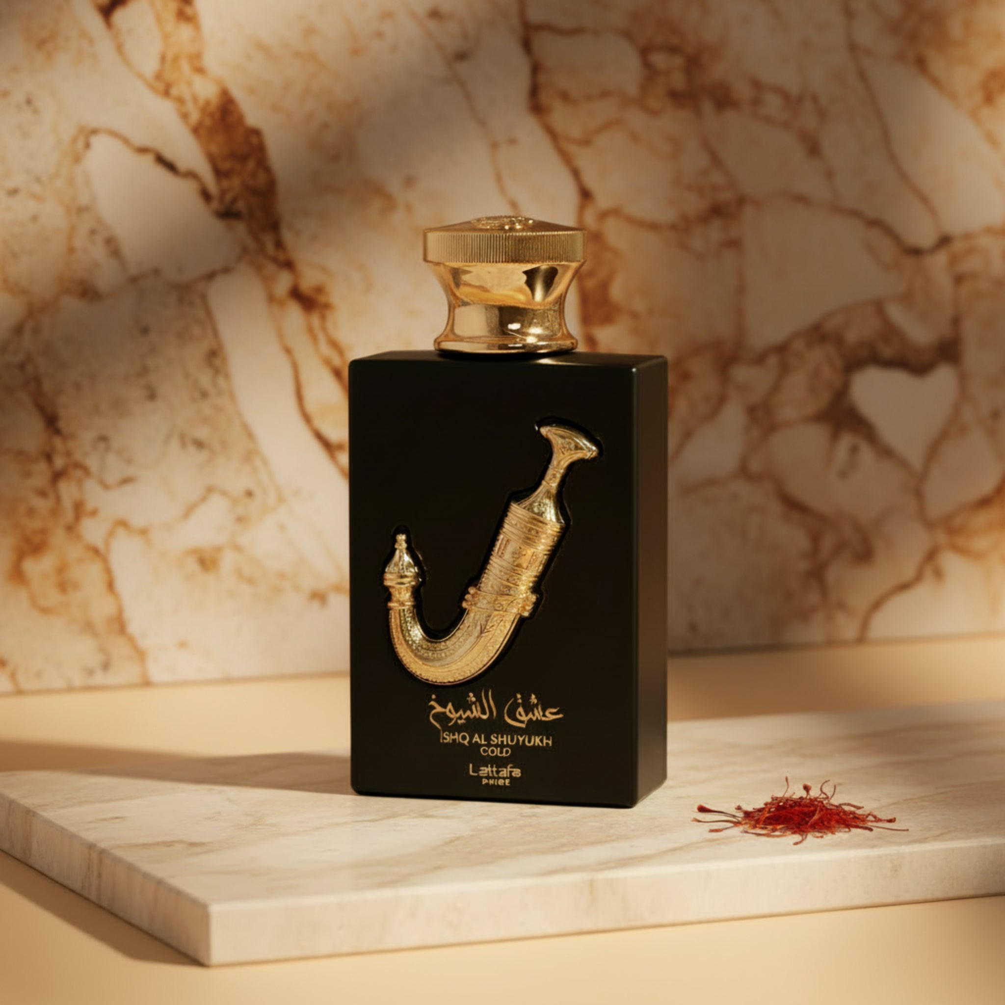 Black and gold perfume bottle with decorative design on a white background