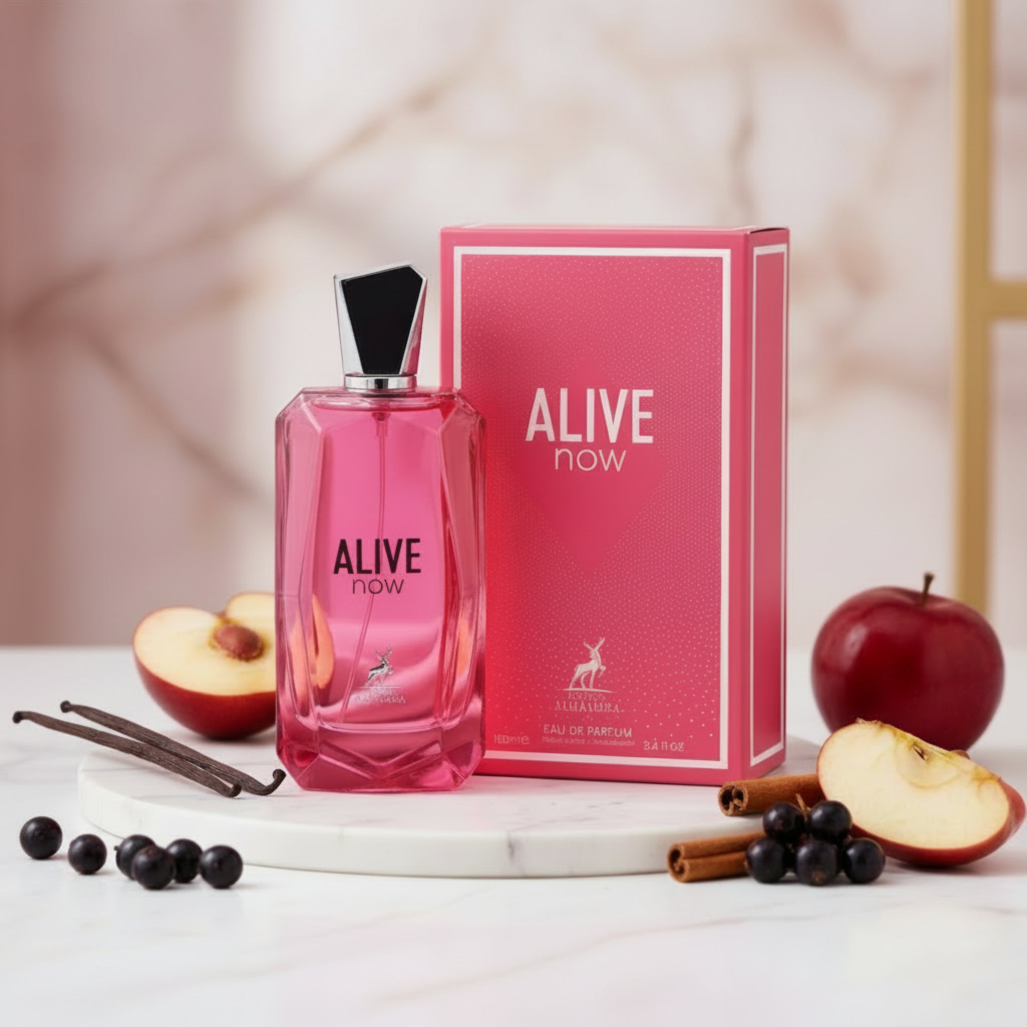Pink 'Alive Now' perfume bottle and packaging on a white background