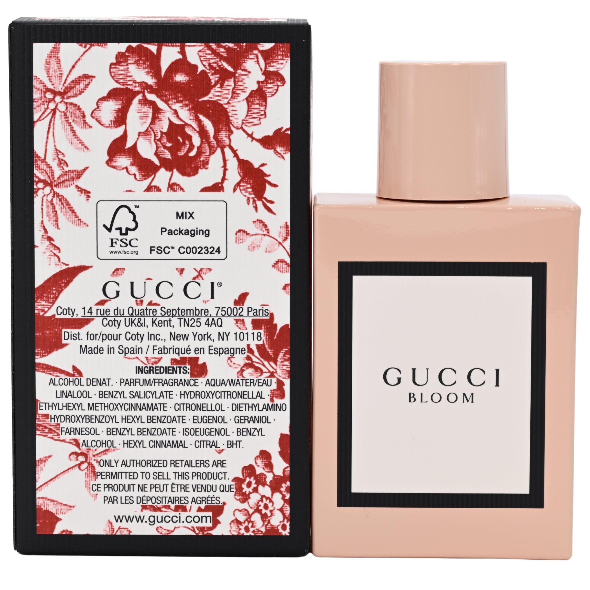 Gucci Bloom perfume bottle and packaging with floral design on a white background