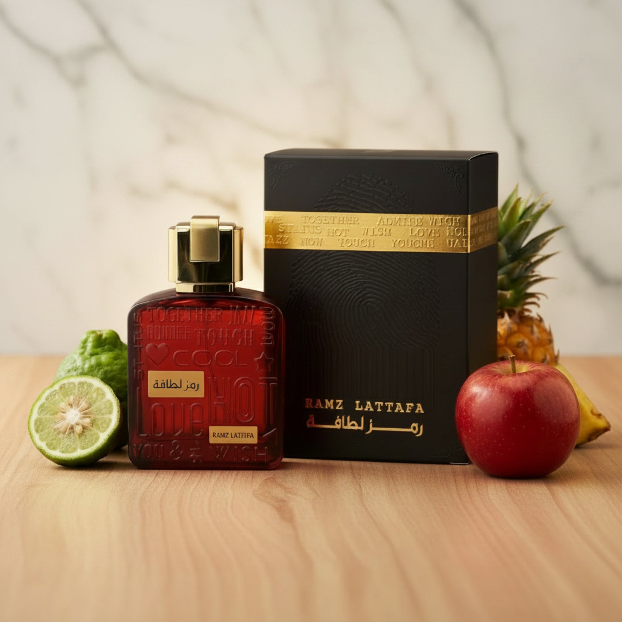 Red perfume bottle with gold cap and black box featuring 'Ramz Lattafa' branding on a white background.