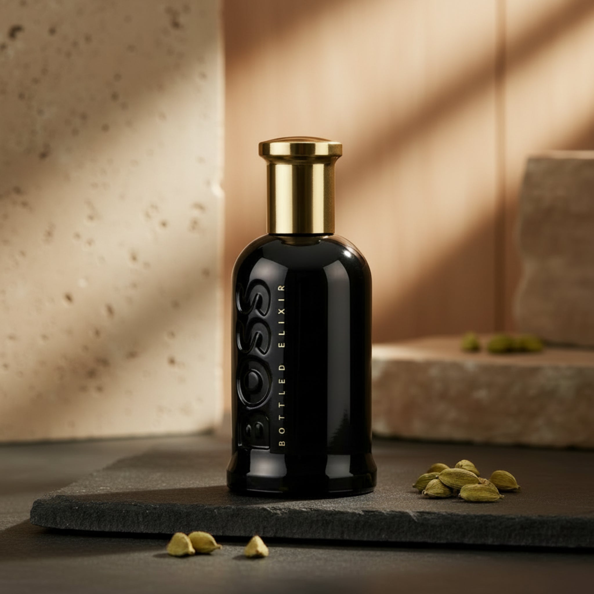 Black perfume bottle with gold cap on a white background