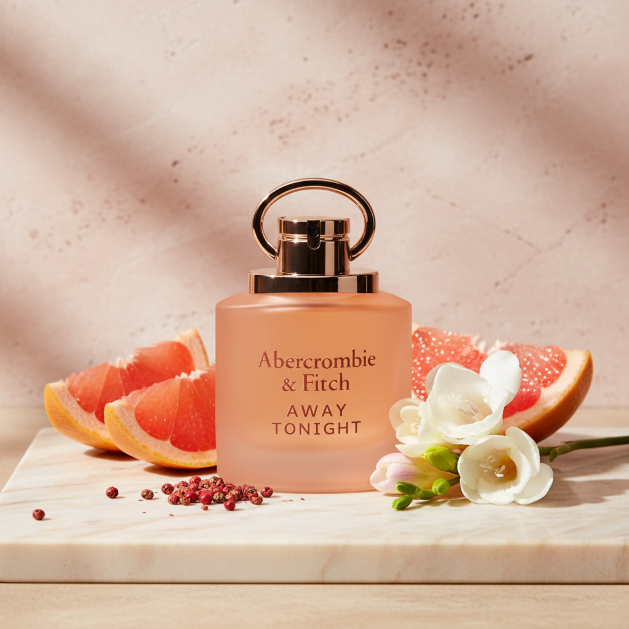 Perfume bottle labeled 'Abercrombie & Fitch Away Tonight' on a white background