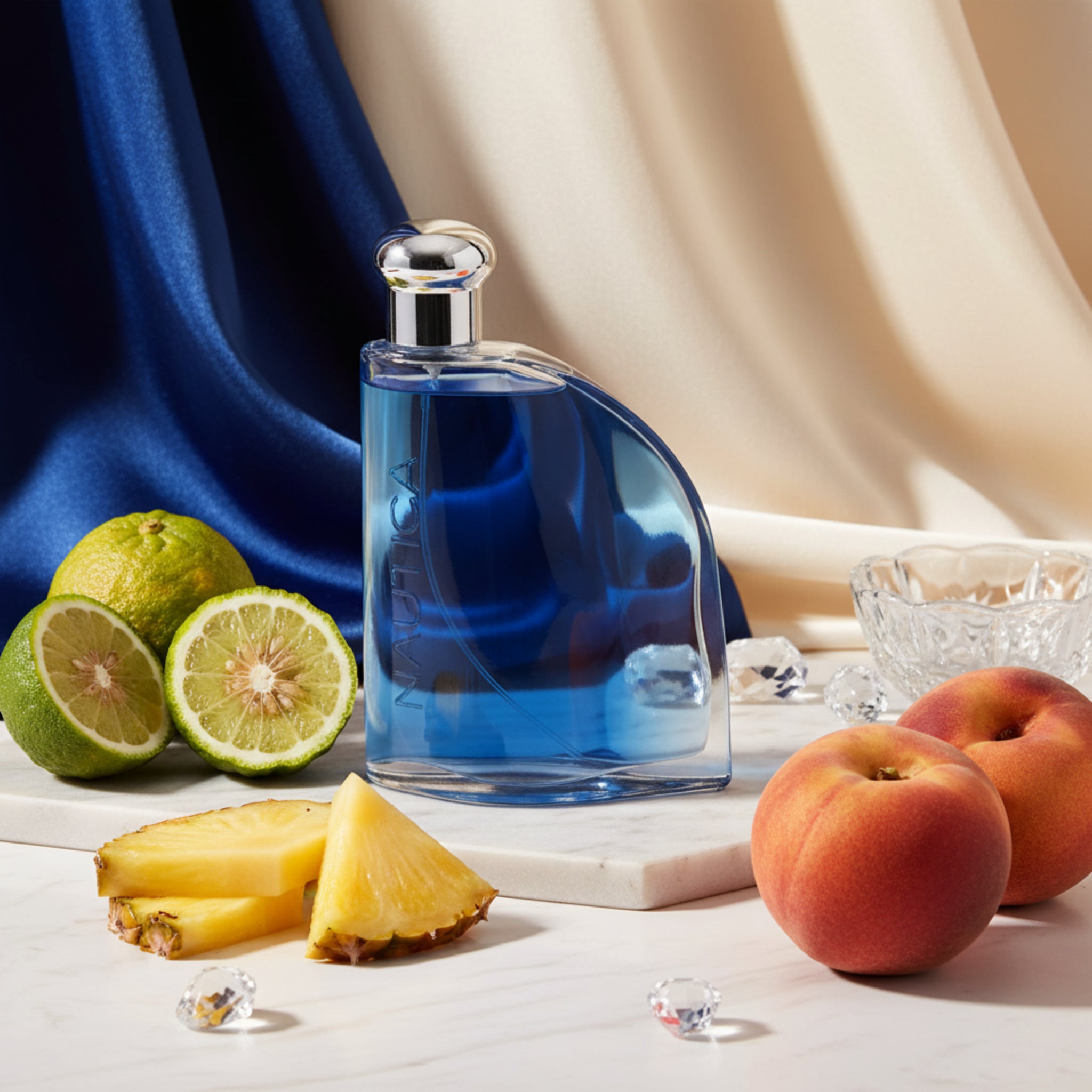 Blue perfume bottle with a silver cap on a white background