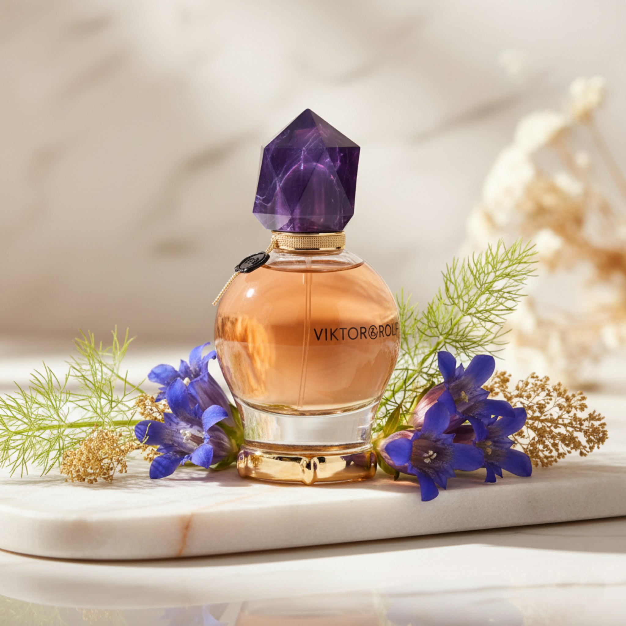 Perfume bottle with geometric cap on a white background