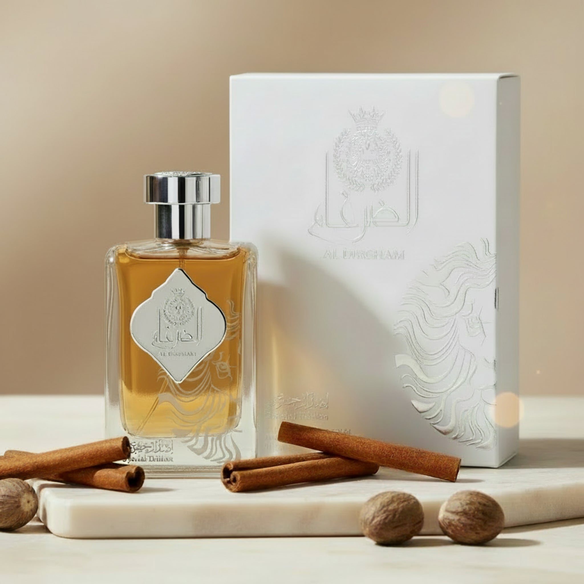 Perfume bottle and packaging with intricate design on a white background