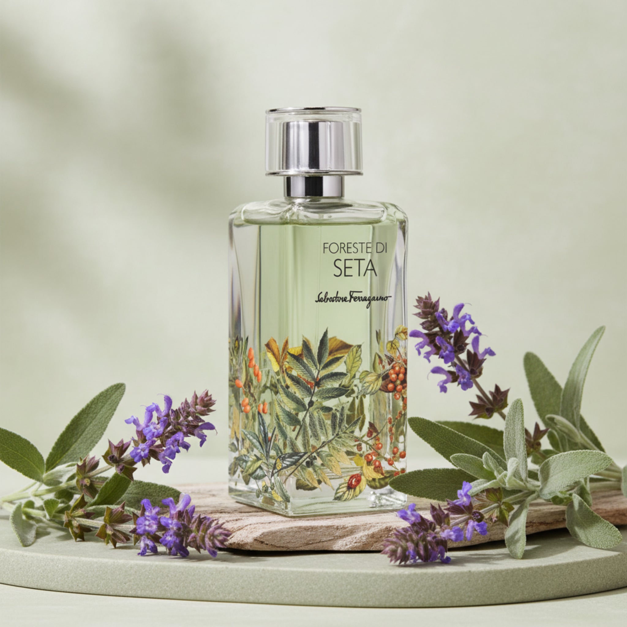 Perfume bottle with floral design on a white background