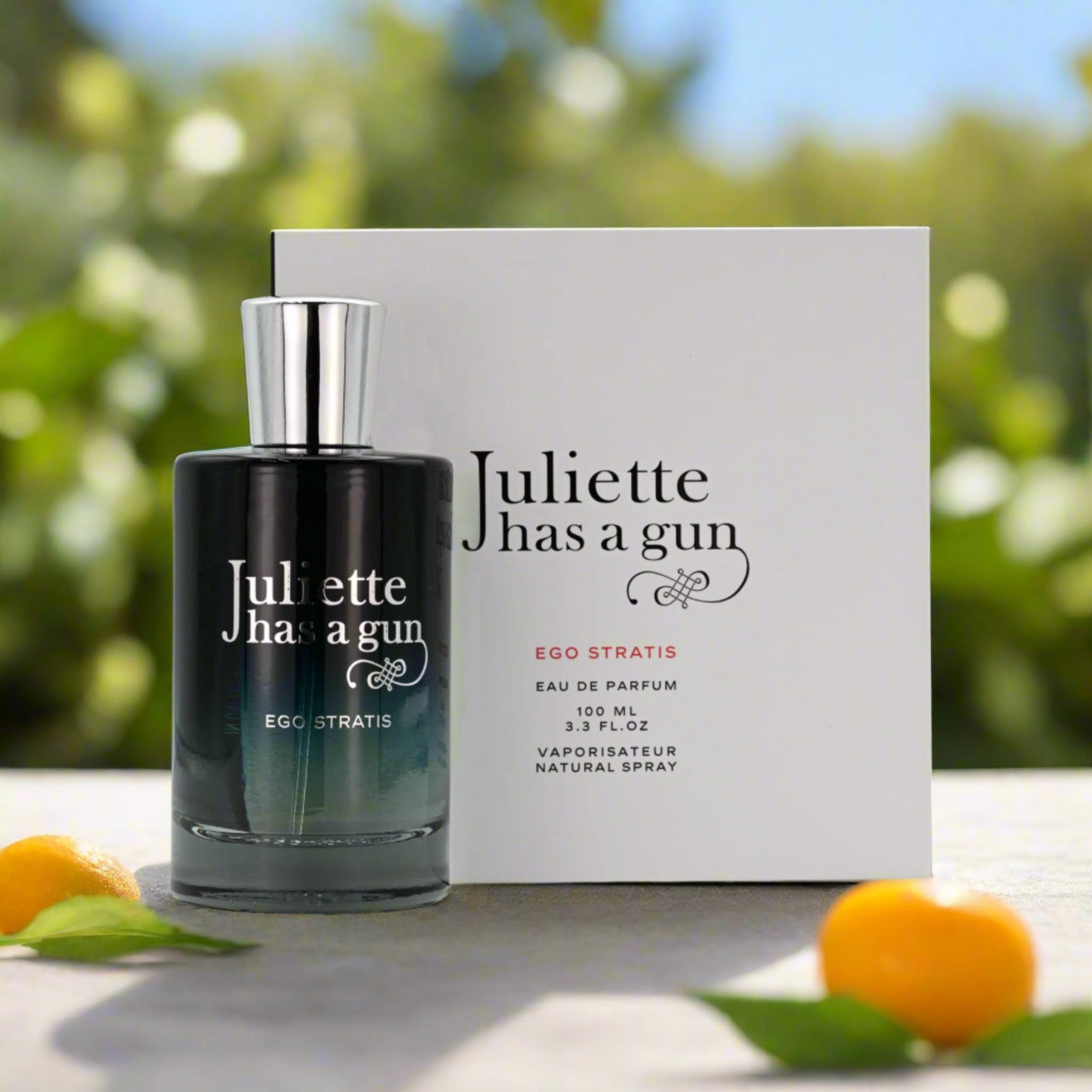 Perfume bottle and packaging of 'Juliette has a gun' on a natural background