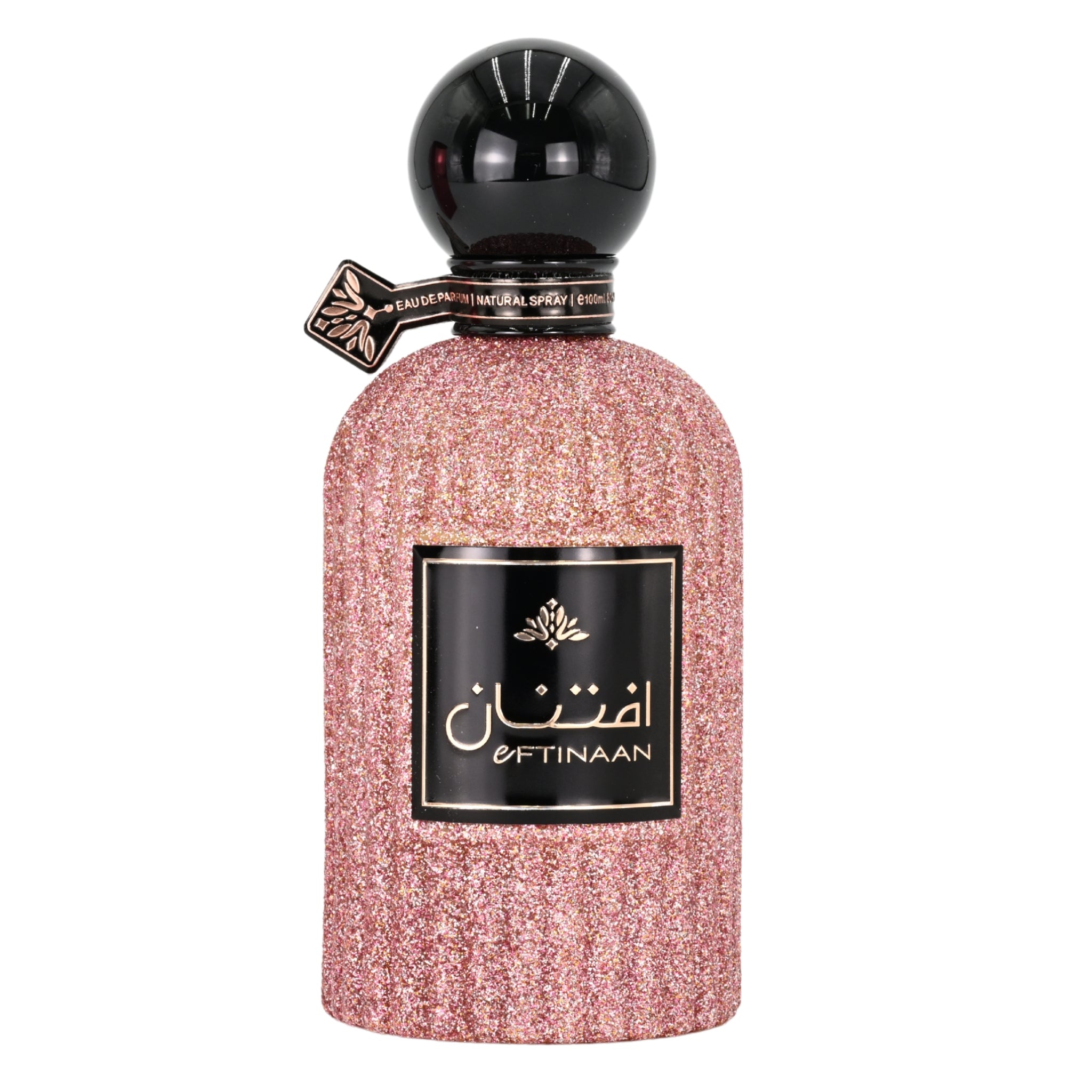 Perfume bottle with pink glittery body and black cap on a white background