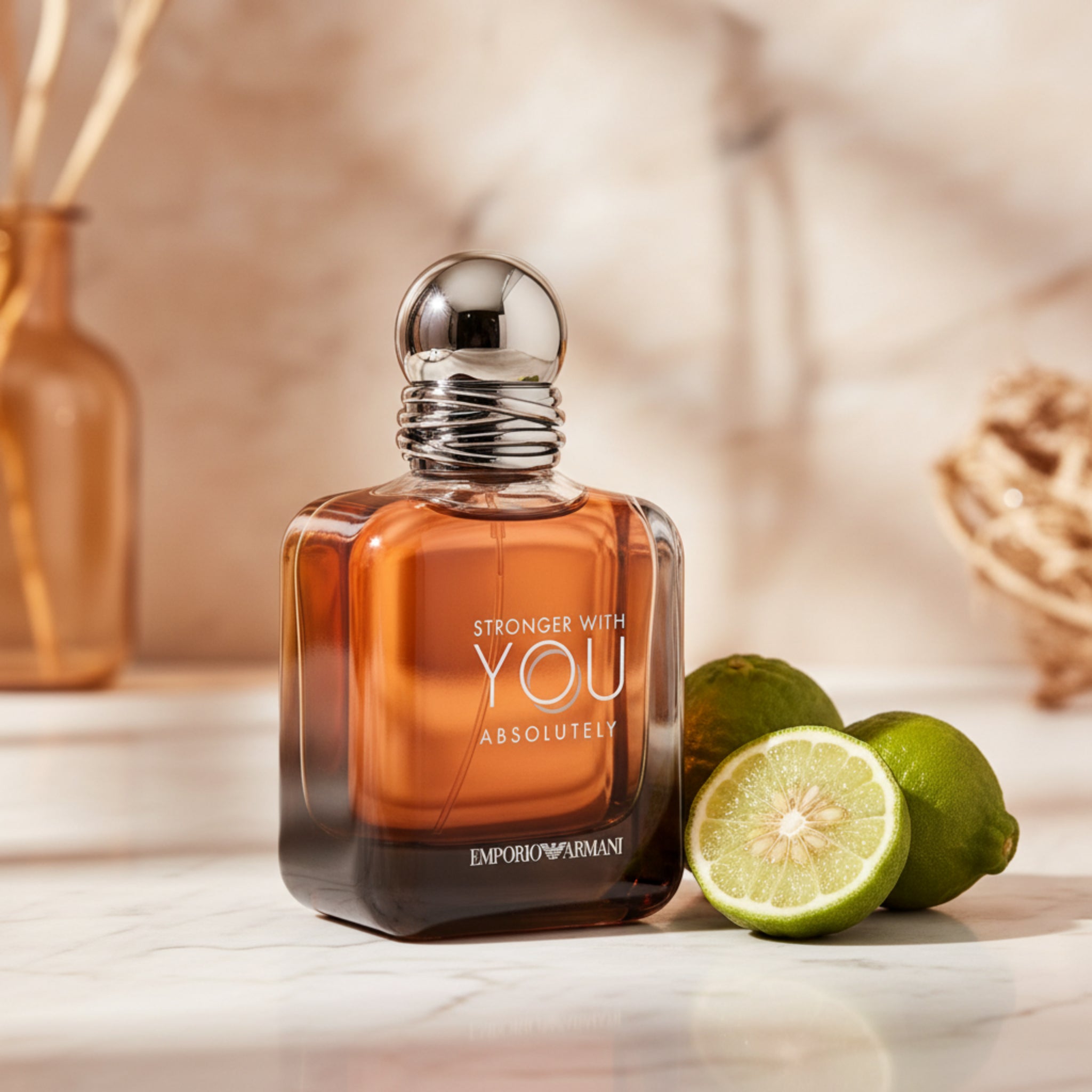 Perfume bottle with 'Stronger with You Absolutely' text and Emporio Armani logo on a white background