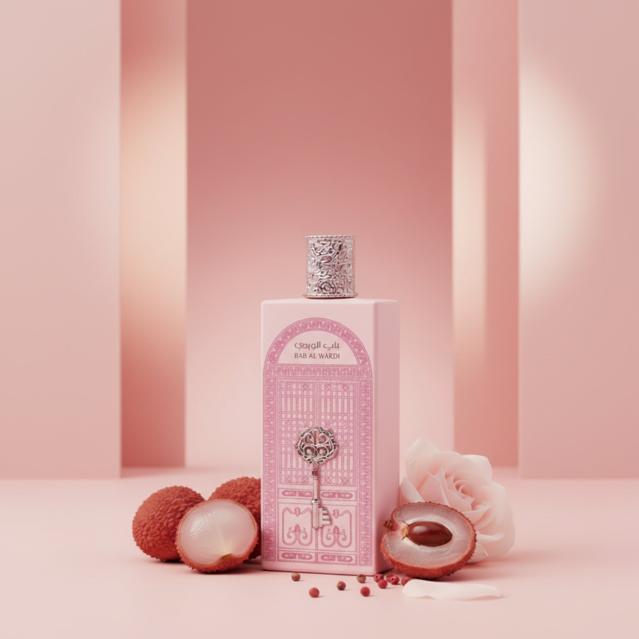 Perfume bottle with pink design and silver cap on a white background