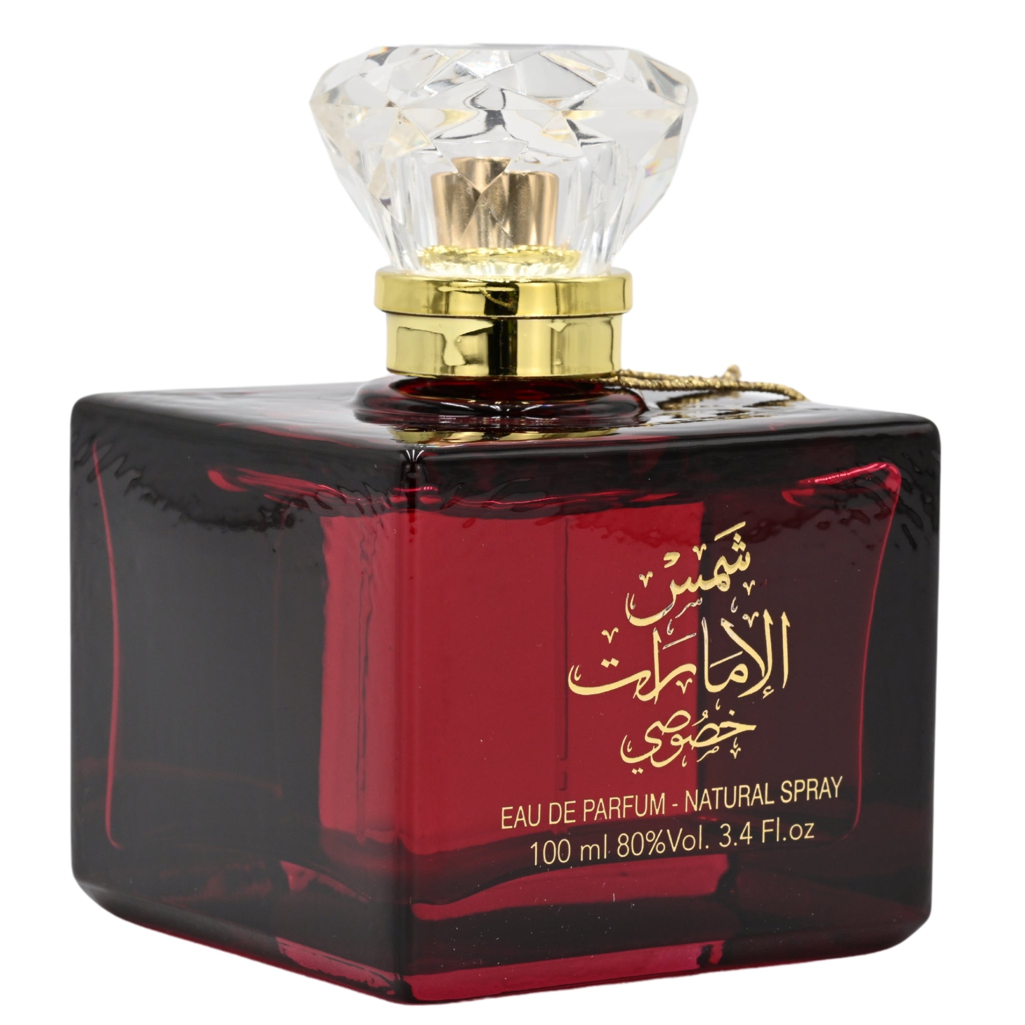 Perfume bottle with red label and gold cap on white background