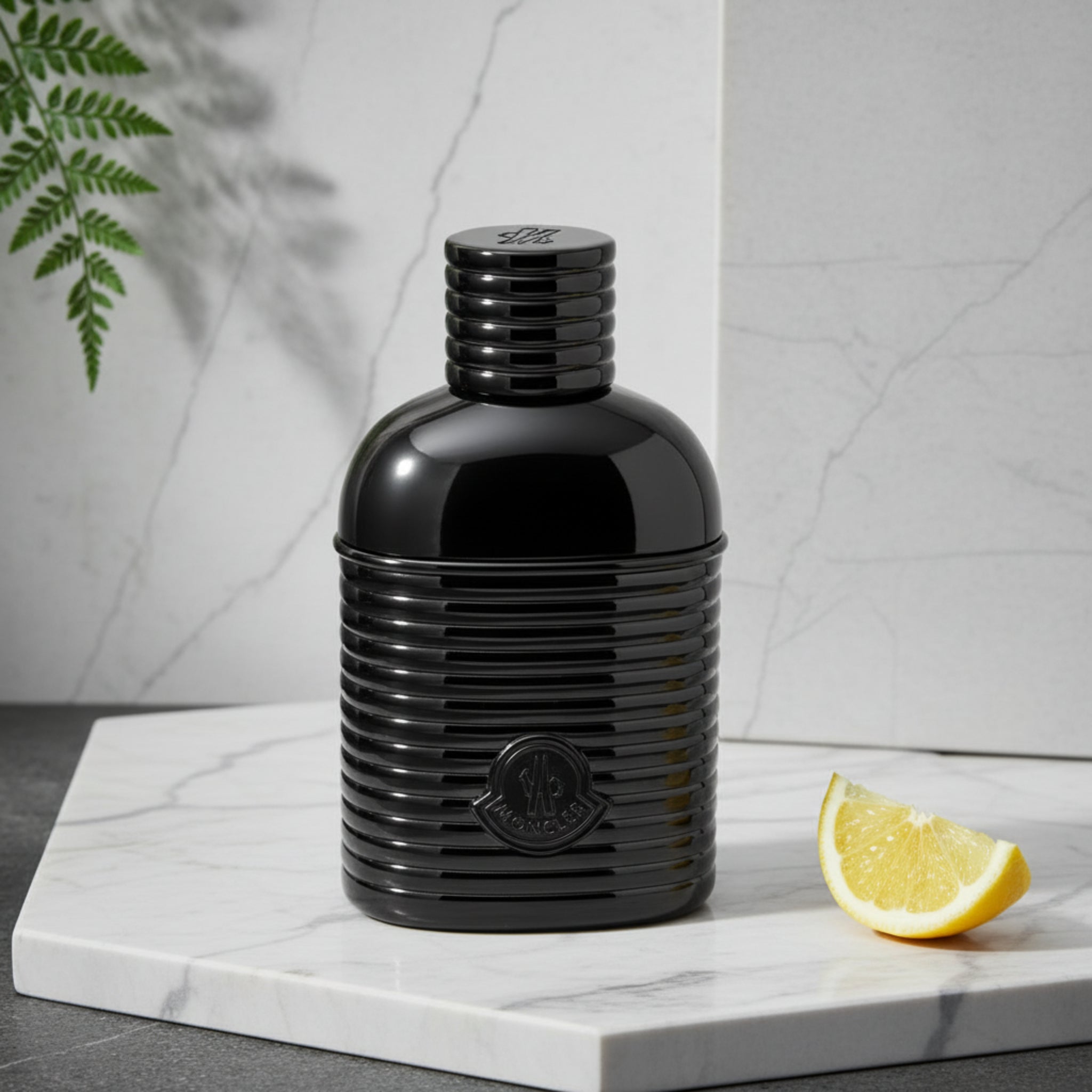 Black perfume bottle with a visible brand logo on a white background