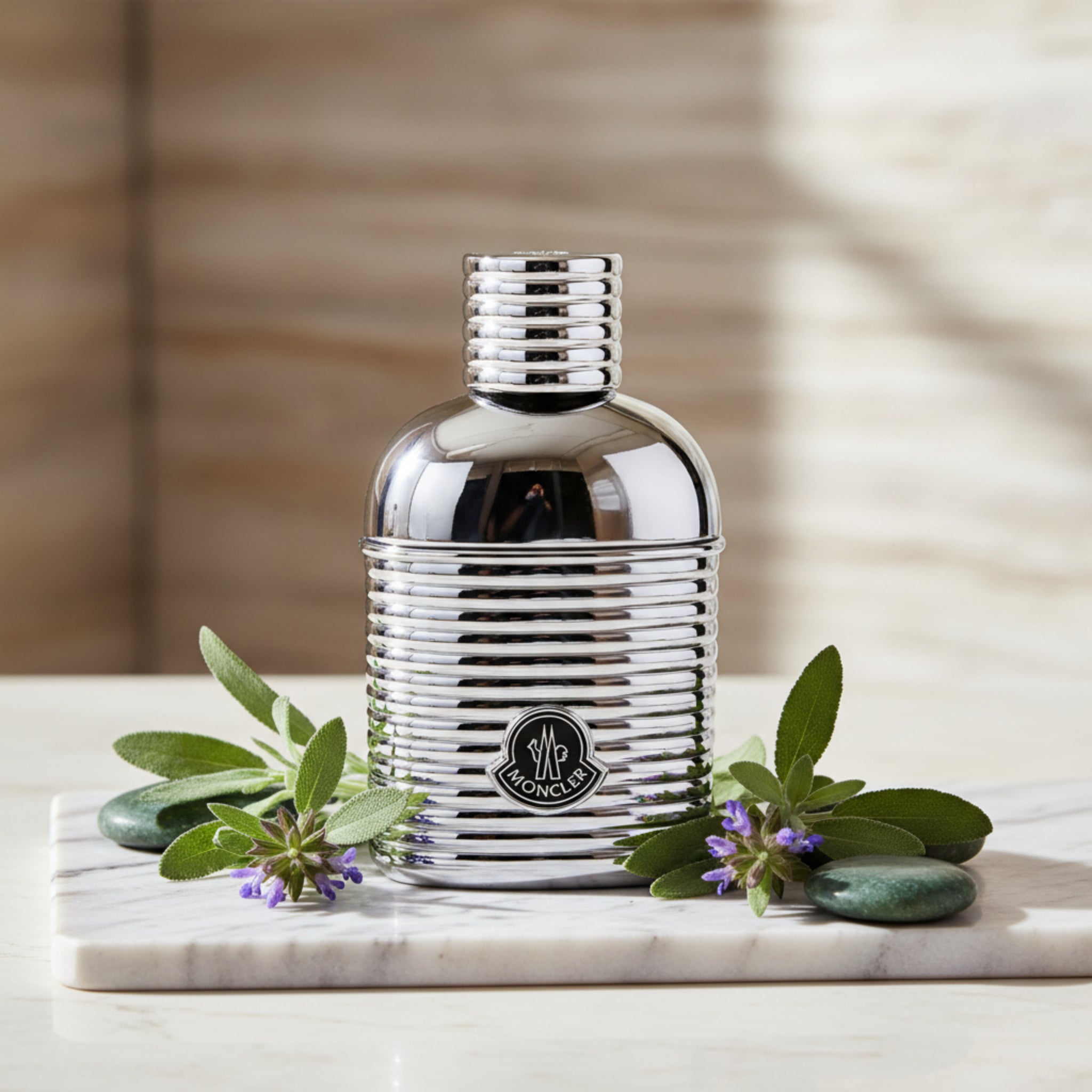Chrome Moncler perfume bottle on a white background