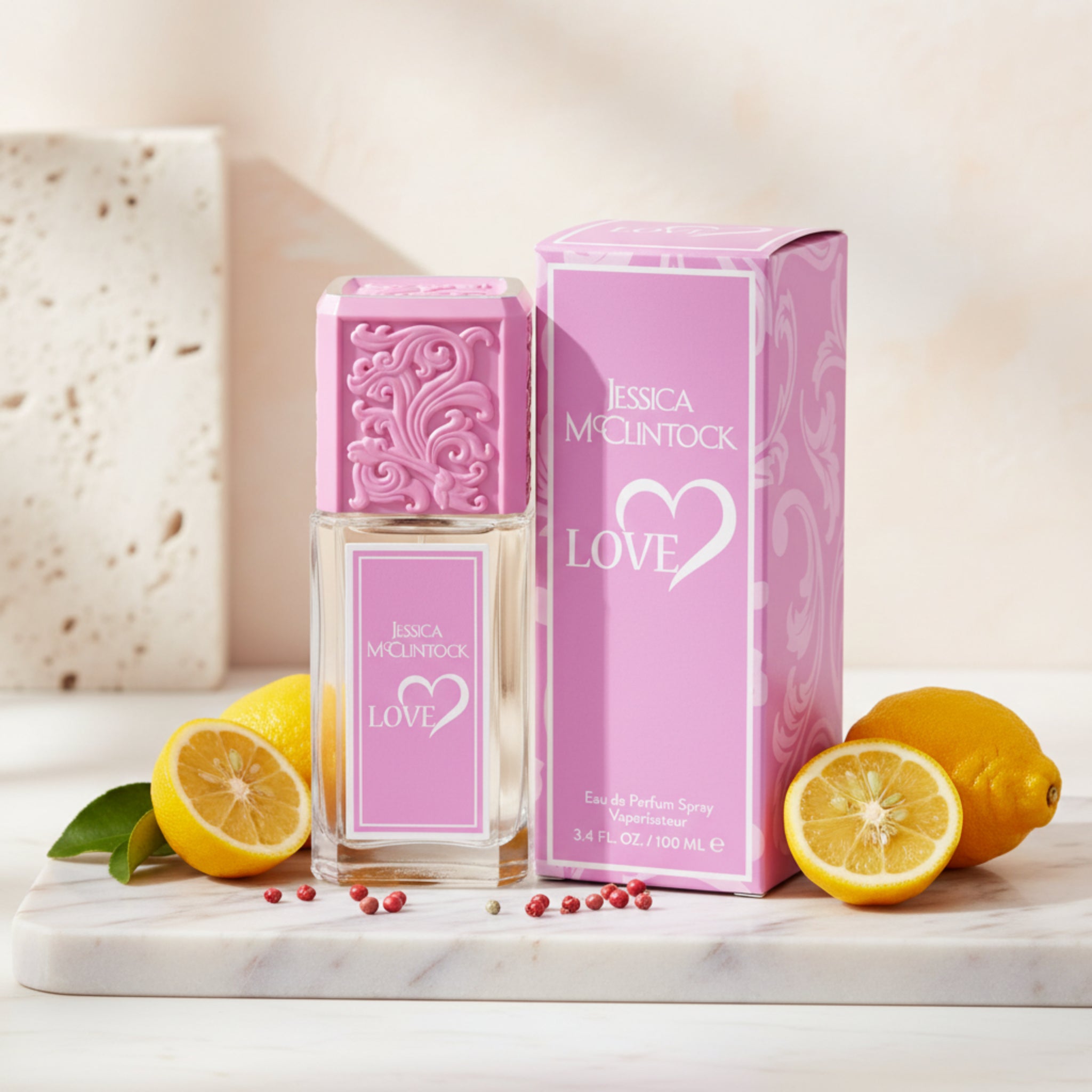Pink Jessica McClintock Love perfume bottle and packaging on a white background