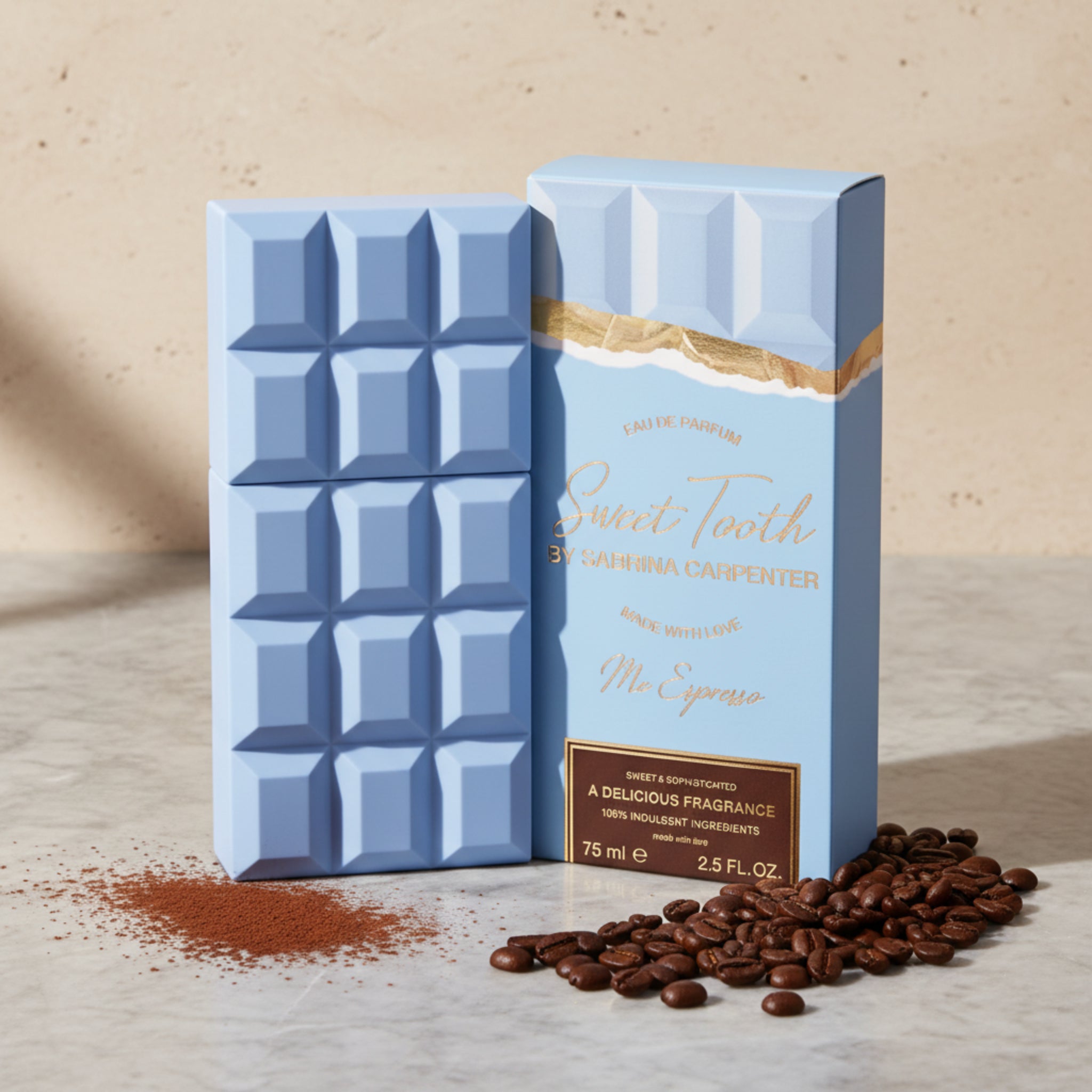 Blue chocolate bar-shaped perfume bottle with box on a white background.