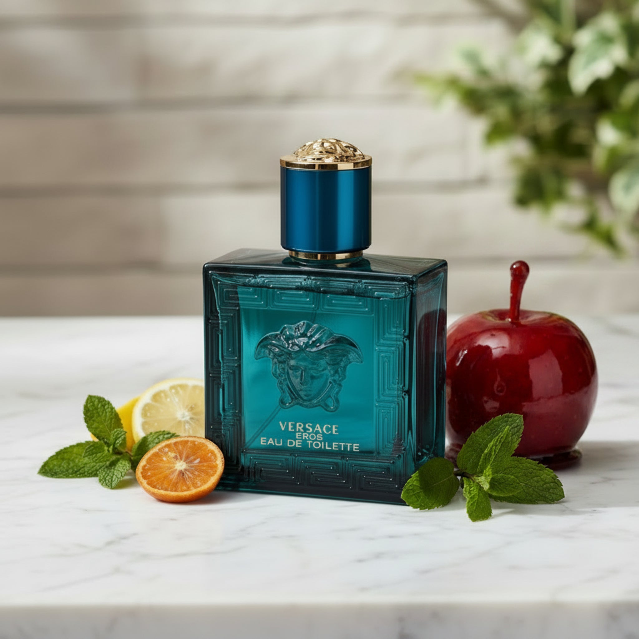 Versace Eros perfume bottle with blue glass and gold cap on a white background