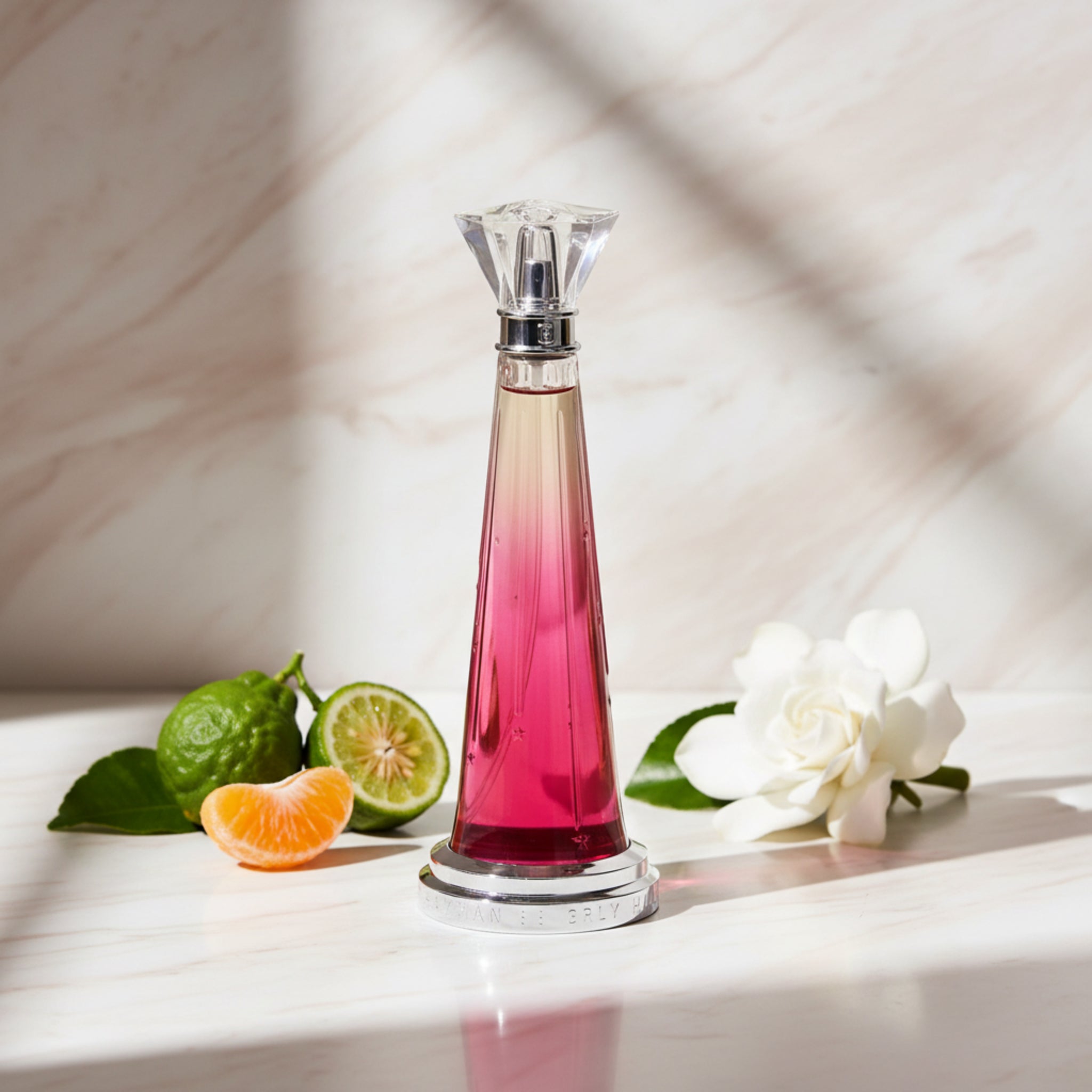 Perfume bottle with gradient color design on a white background