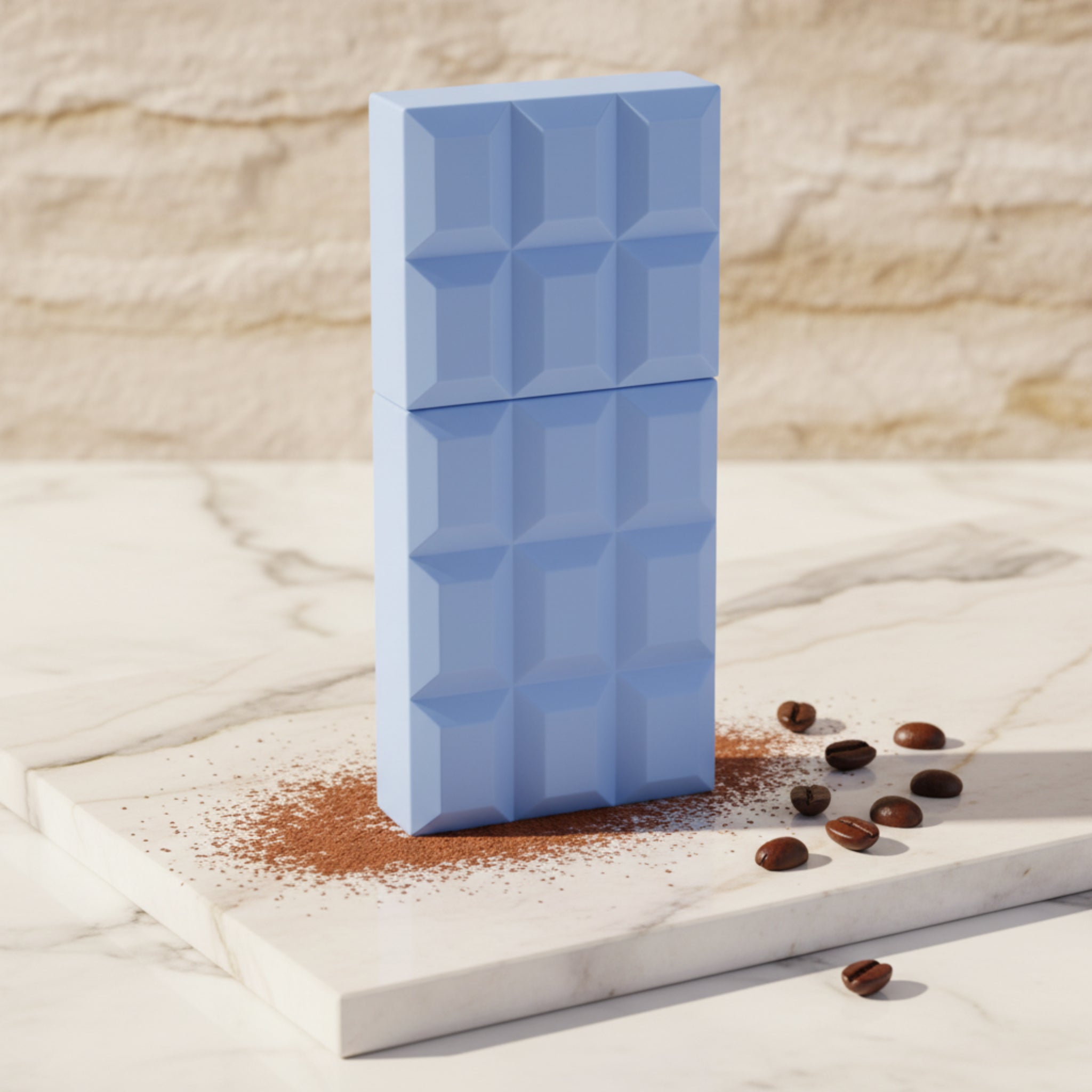 Blue chocolate bar-shaped perfume bottle on a white background.