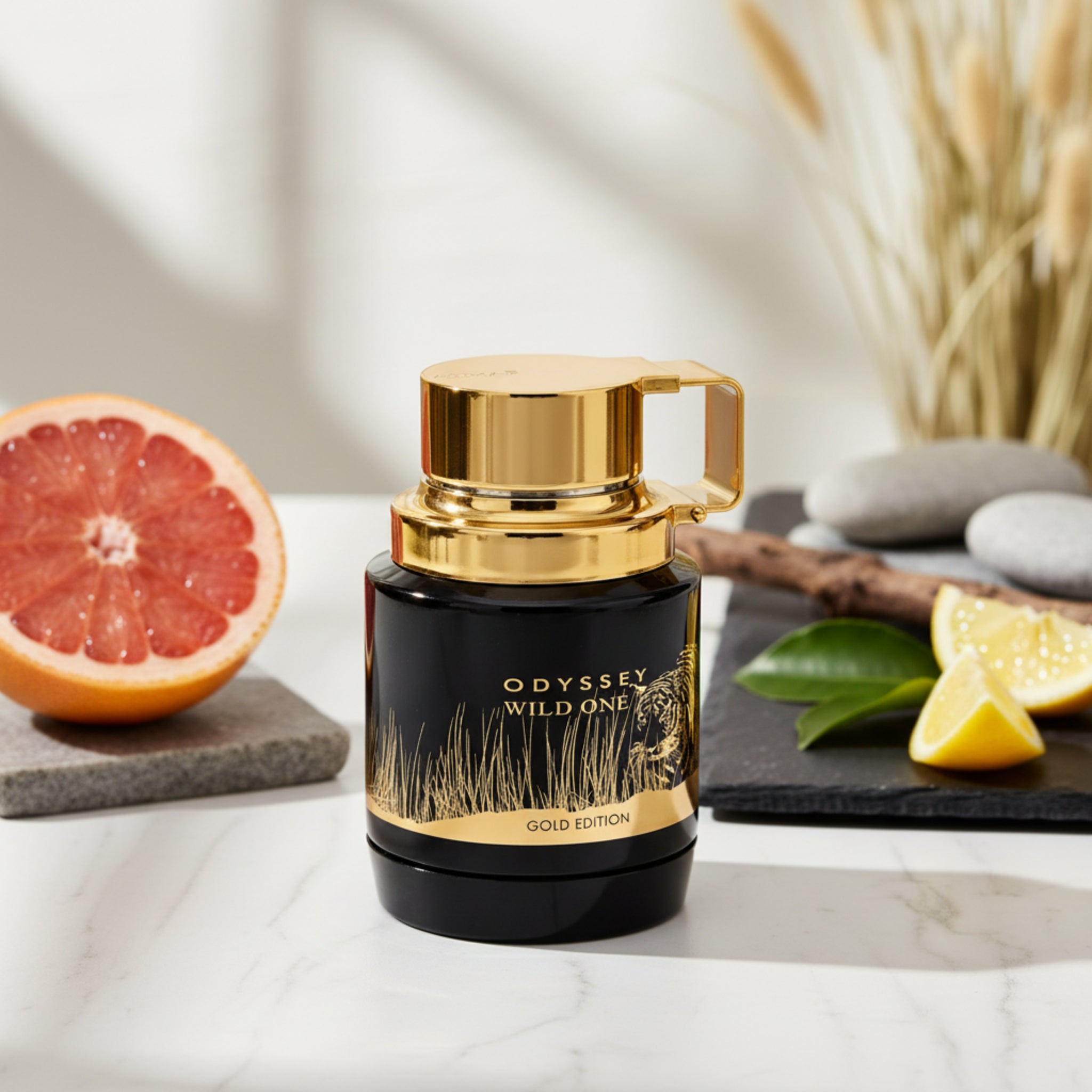 Perfume bottle with gold cap and black body featuring 'Odyssey Wild One' text and tiger illustration.