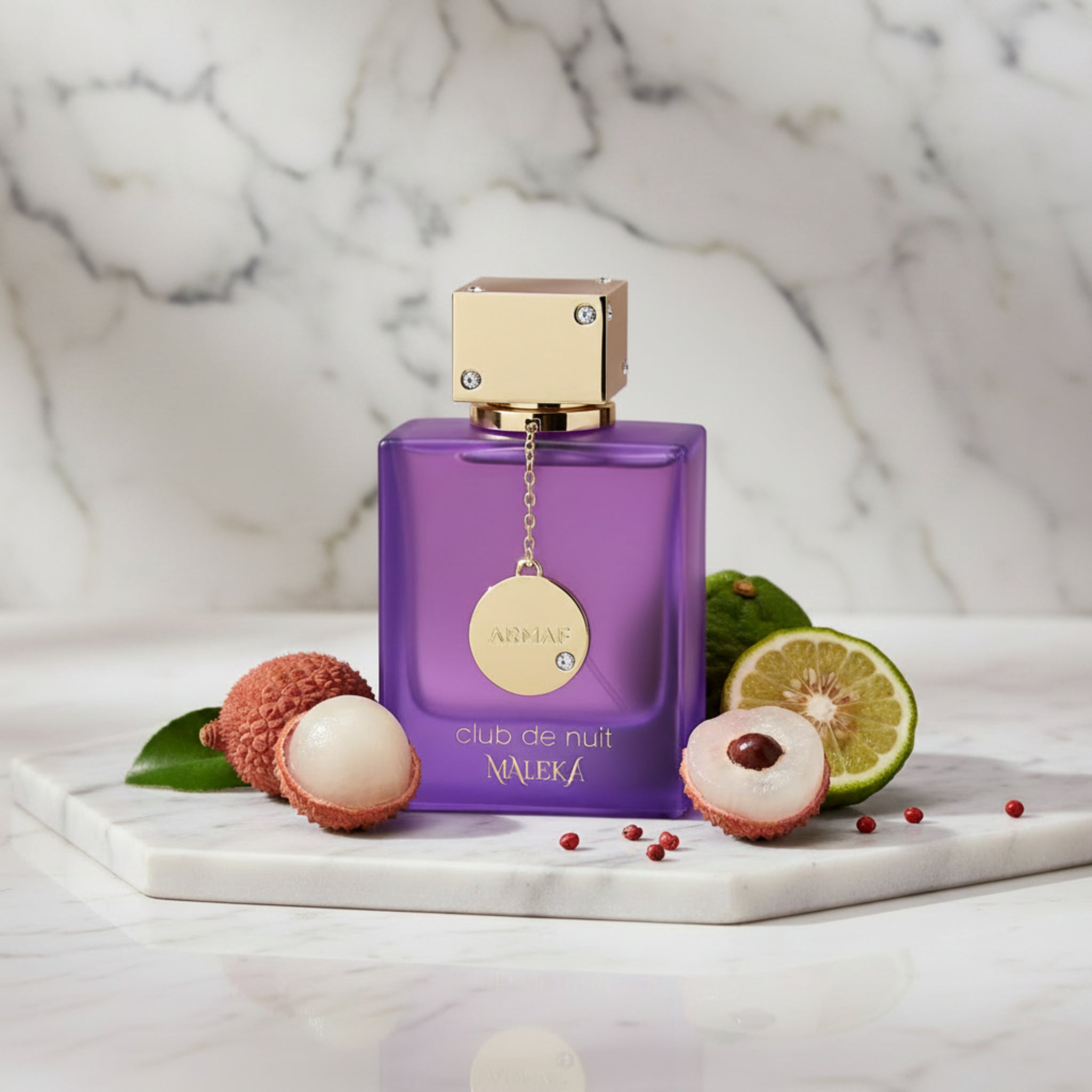 Purple perfume bottle with gold cap and label on a white background