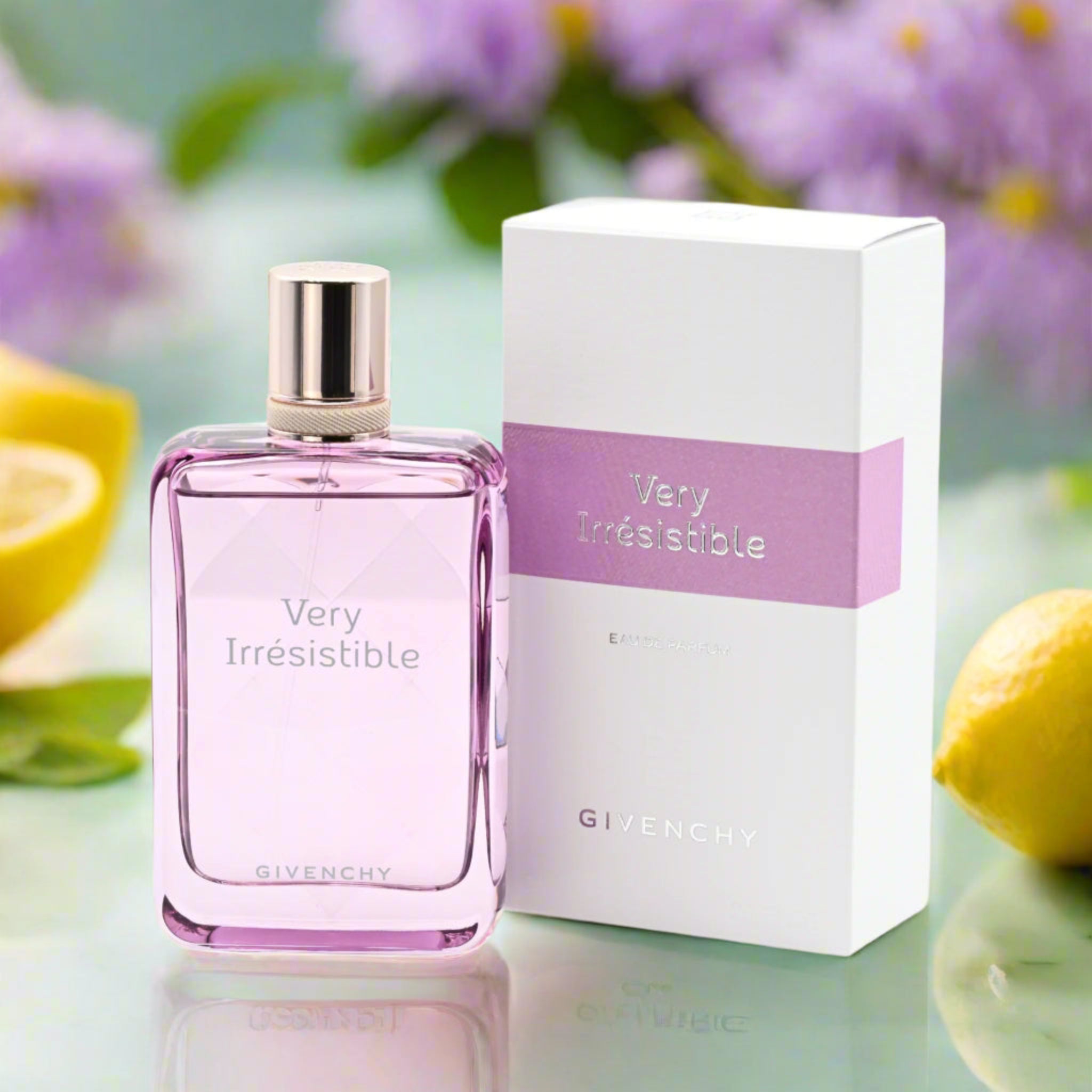 Givenchy 'Very Irresistible' perfume bottle and packaging with lemons and flowers in the background