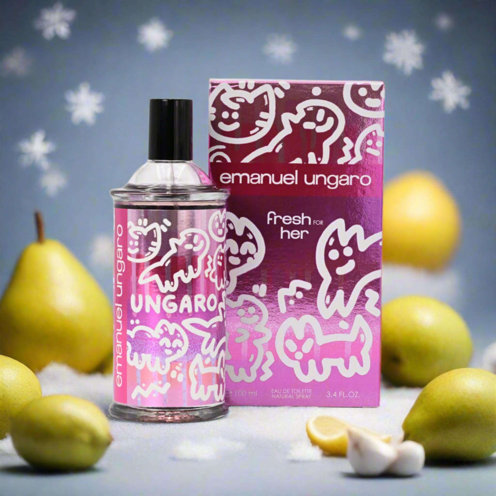 Emanuel Ungaro perfume bottle and packaging with pears on a decorative background