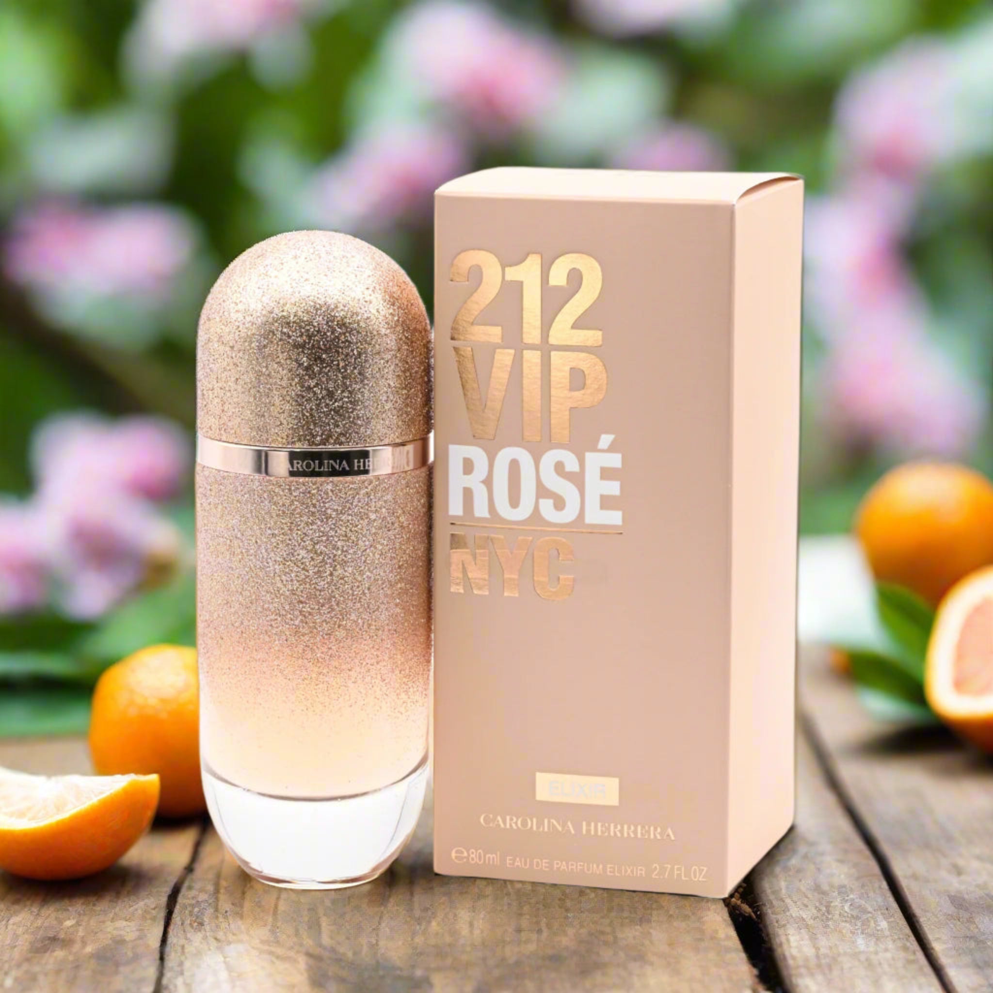 212 VIP Rosé NYC perfume bottle and packaging on a wooden surface with fruits in the background