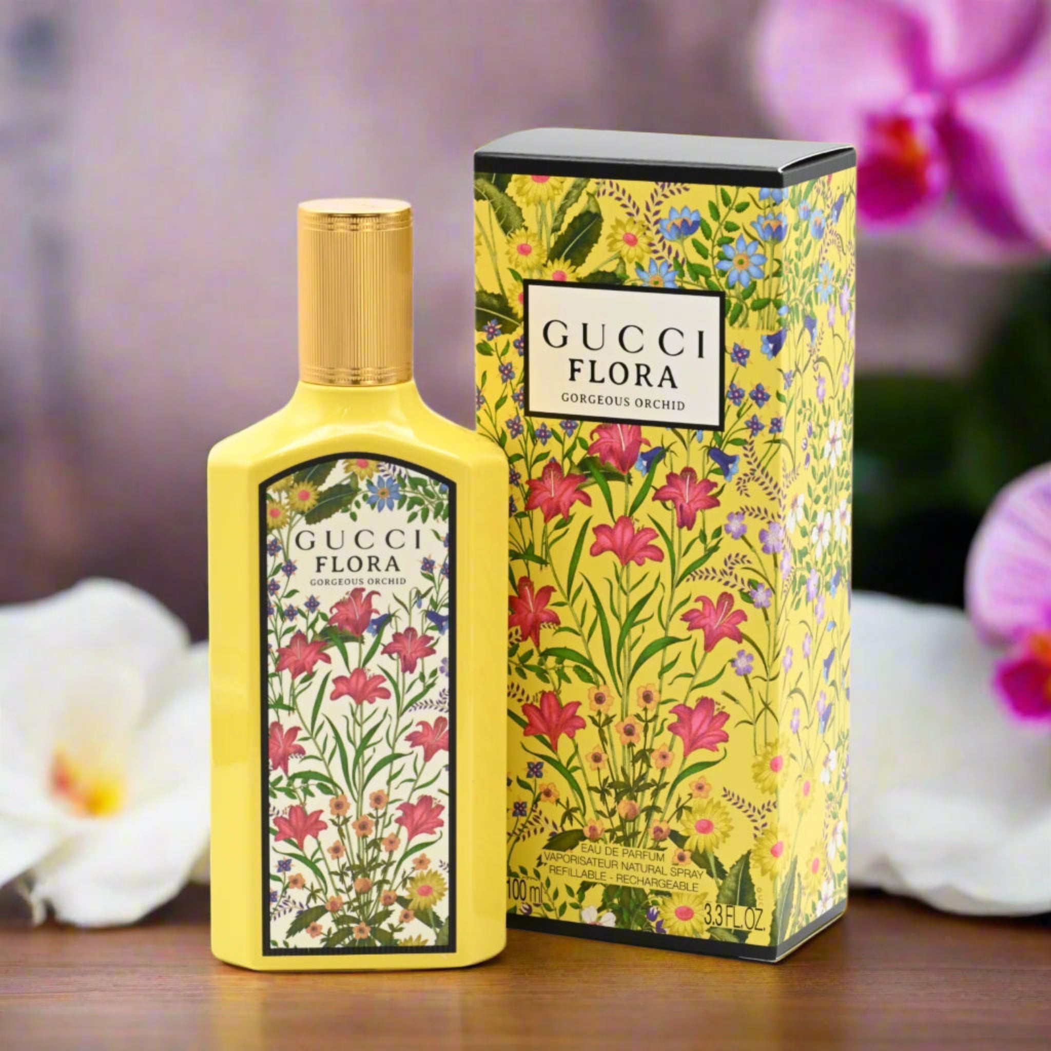 Gucci Flora perfume bottle and packaging with floral design on a wooden surface.