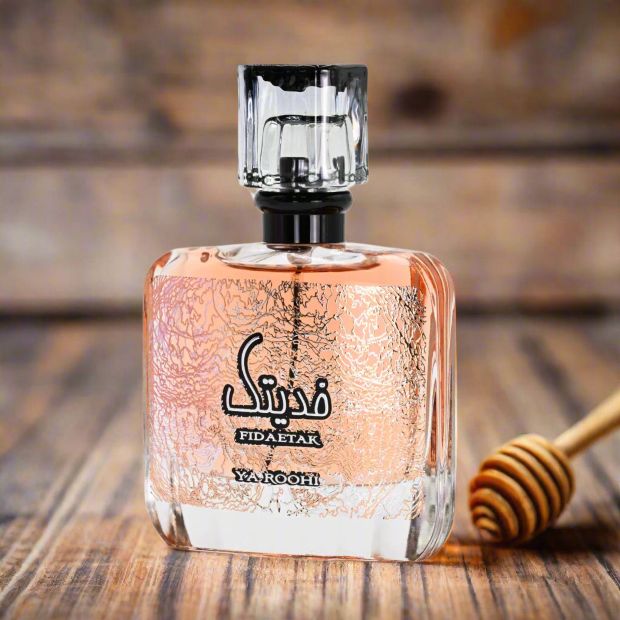 Perfume bottle with decorative design on a wooden surface