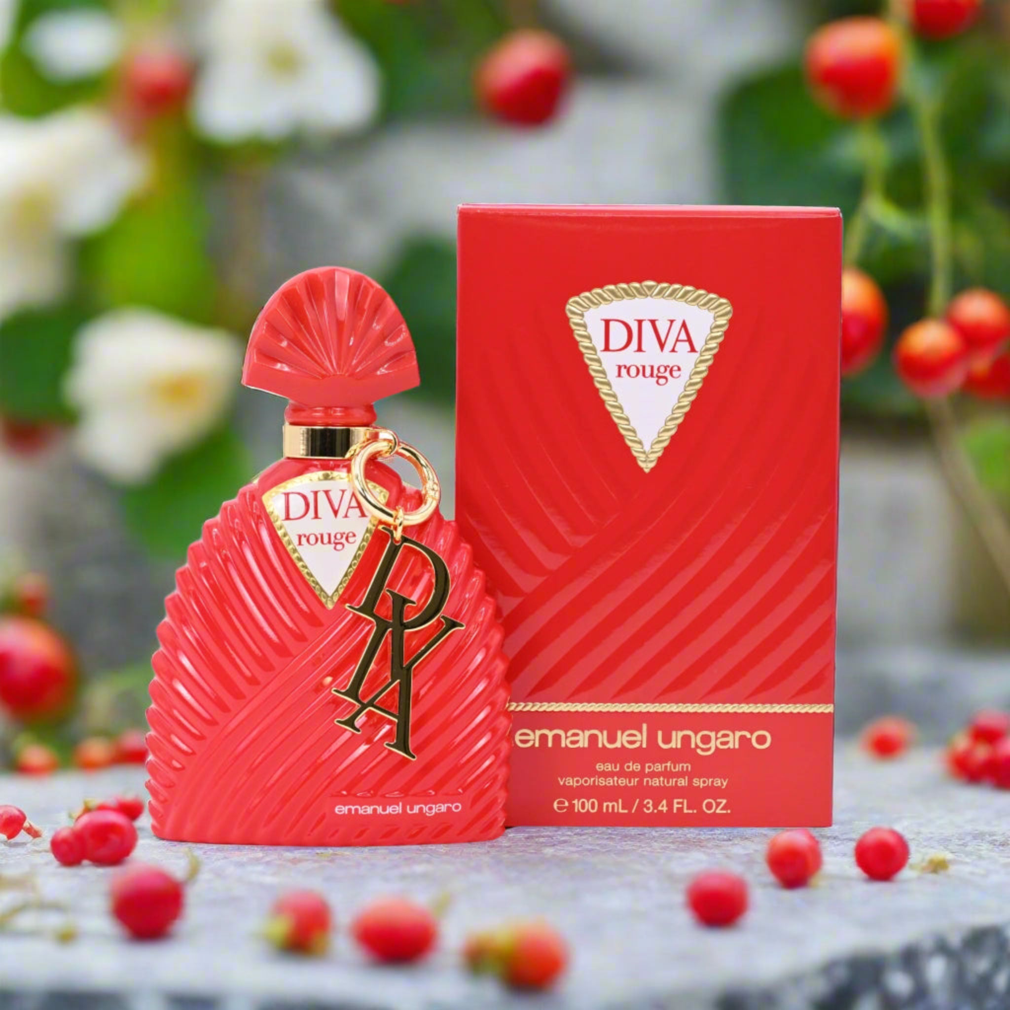 Red 'DIVA rouge' perfume bottle and packaging with floral and berry background