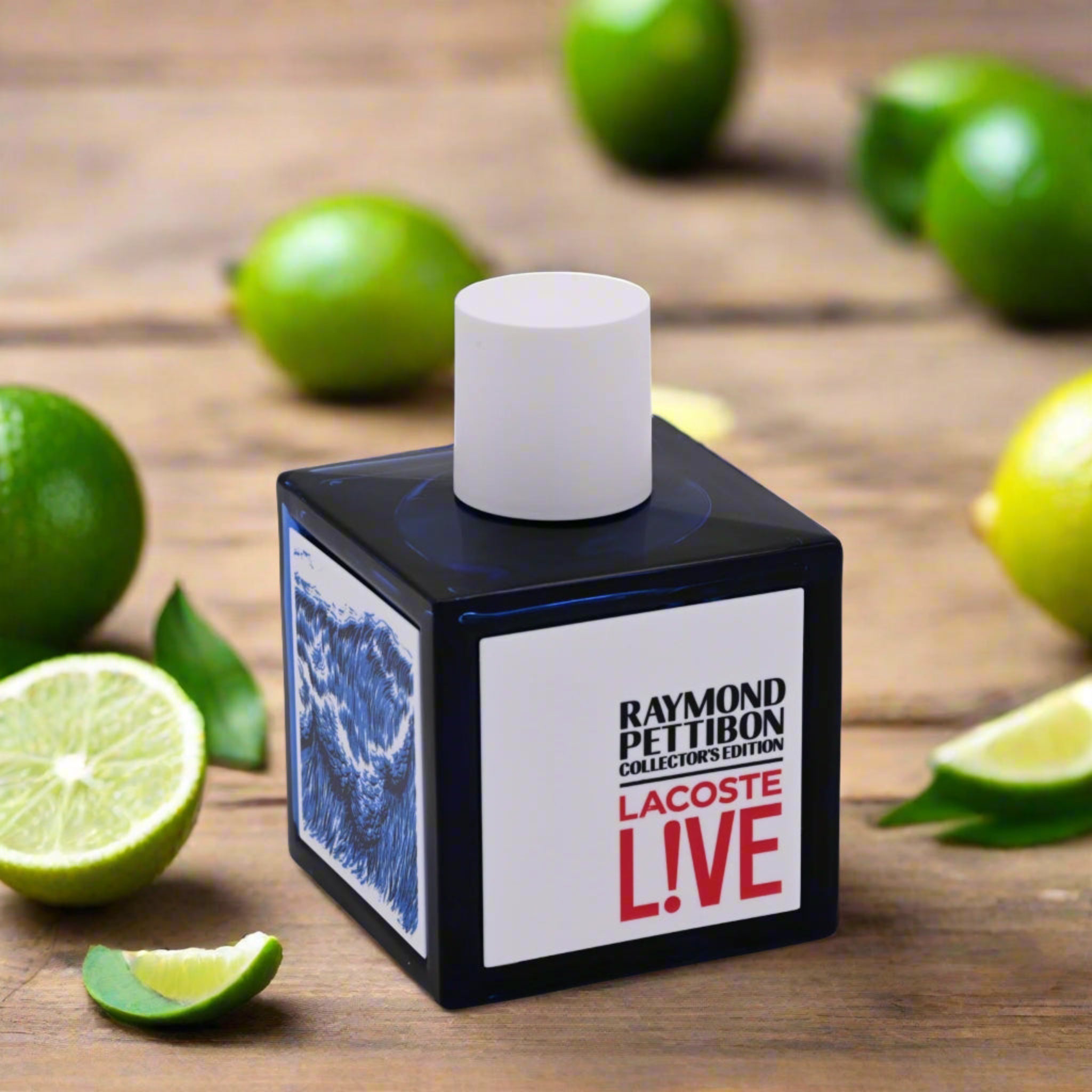 Perfume bottle labeled 'Lacoste Live' surrounded by limes on a wooden surface