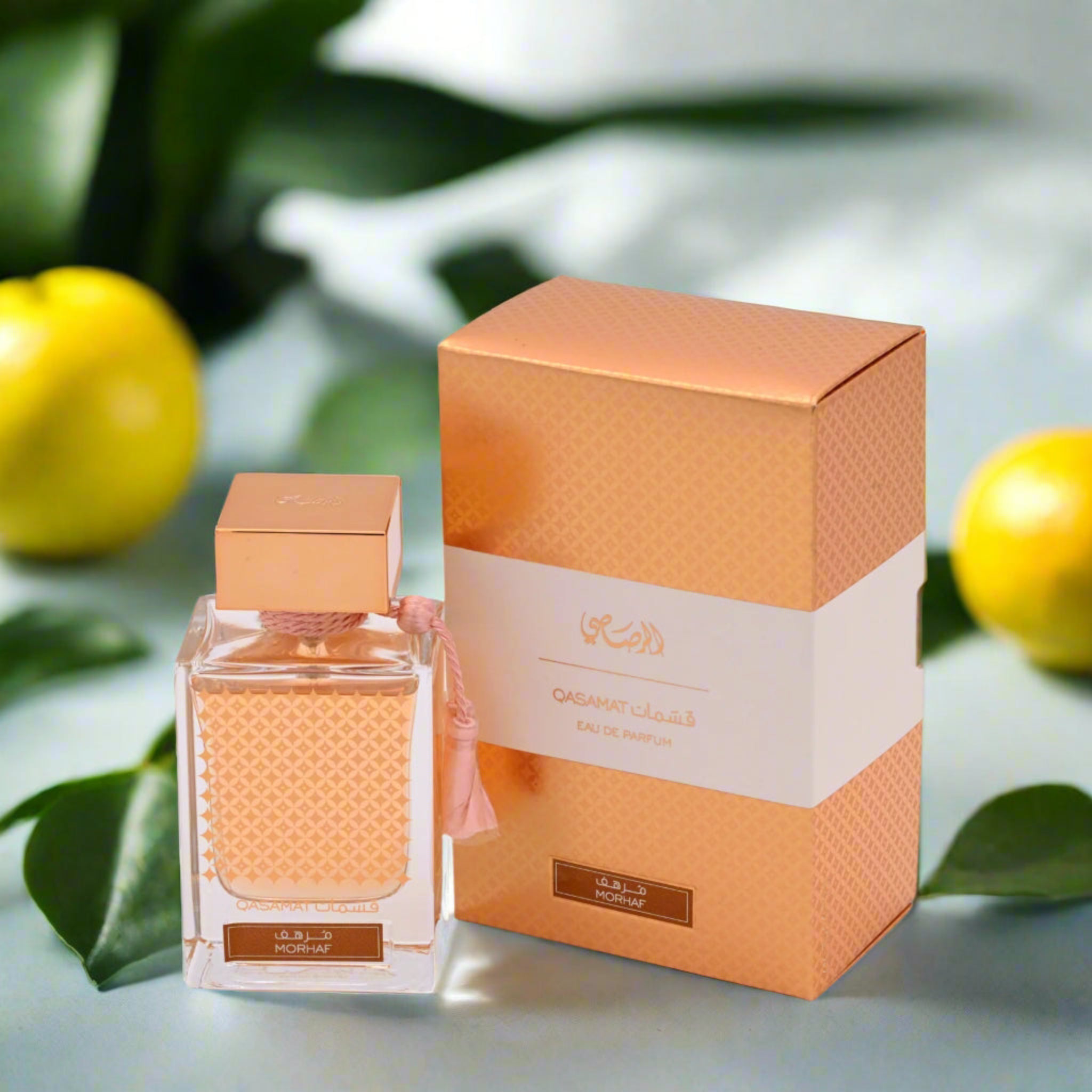 Perfume bottle and packaging with lemons and leaves in the background