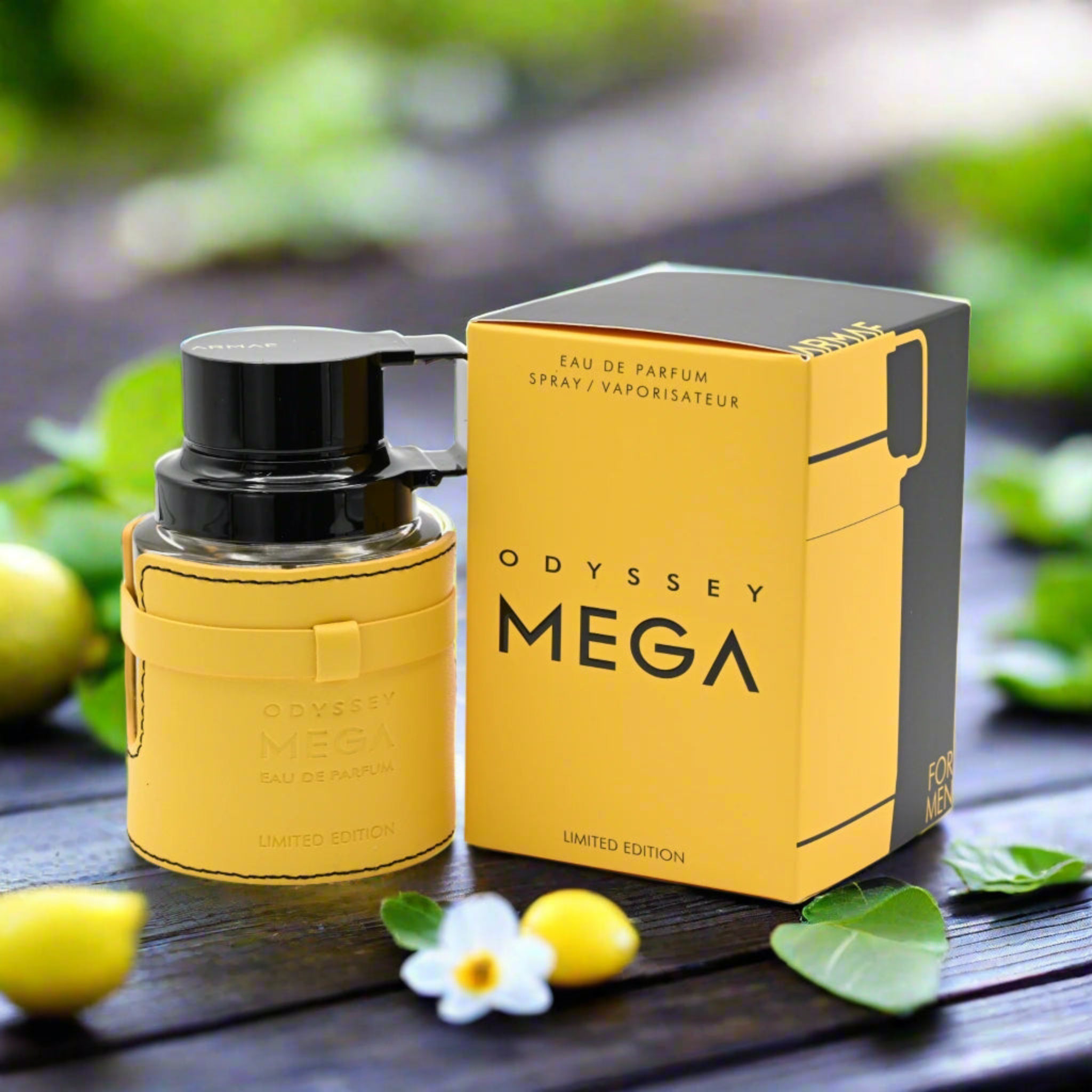 Odyssey Mega perfume bottle and packaging on a wooden surface with greenery in the background