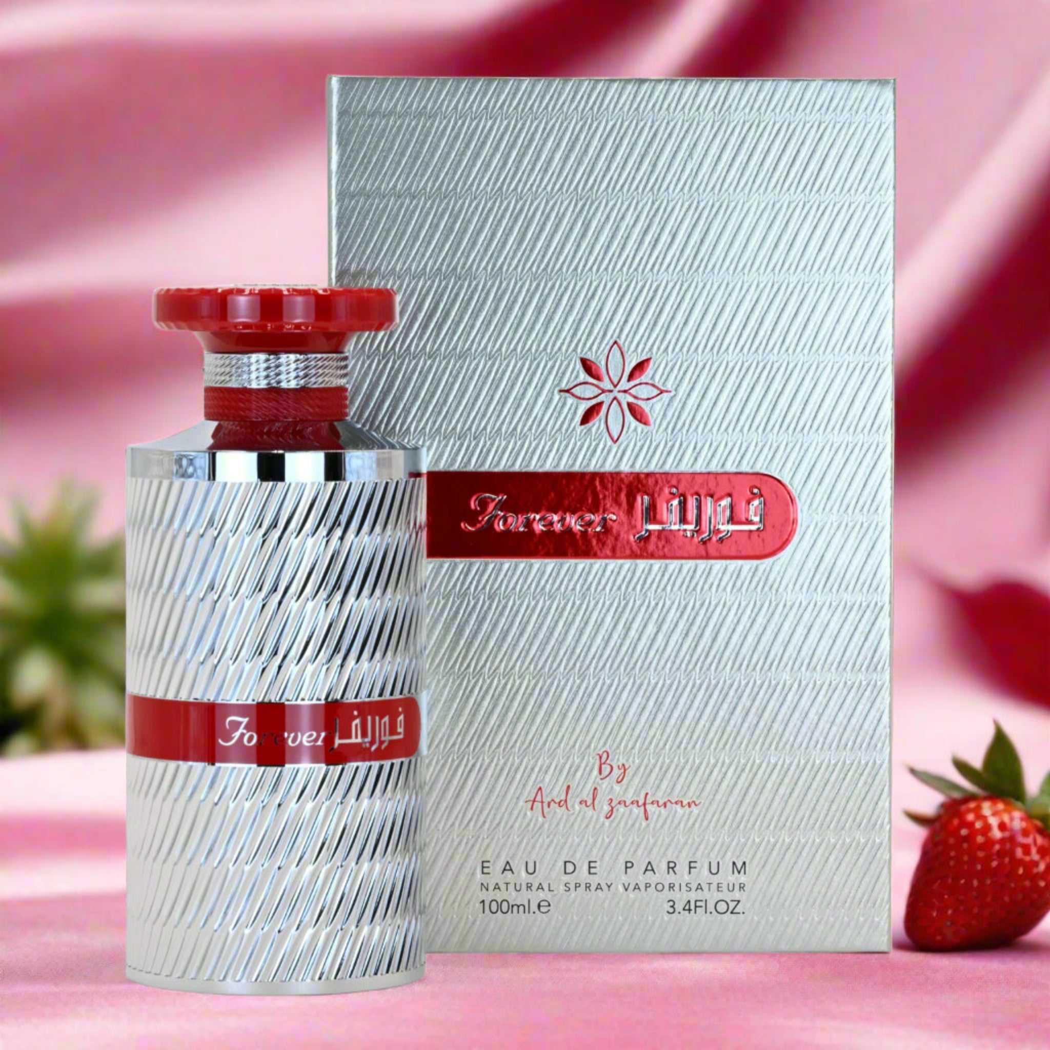 Perfume bottle and packaging with 'Forever Red' branding on a pink background