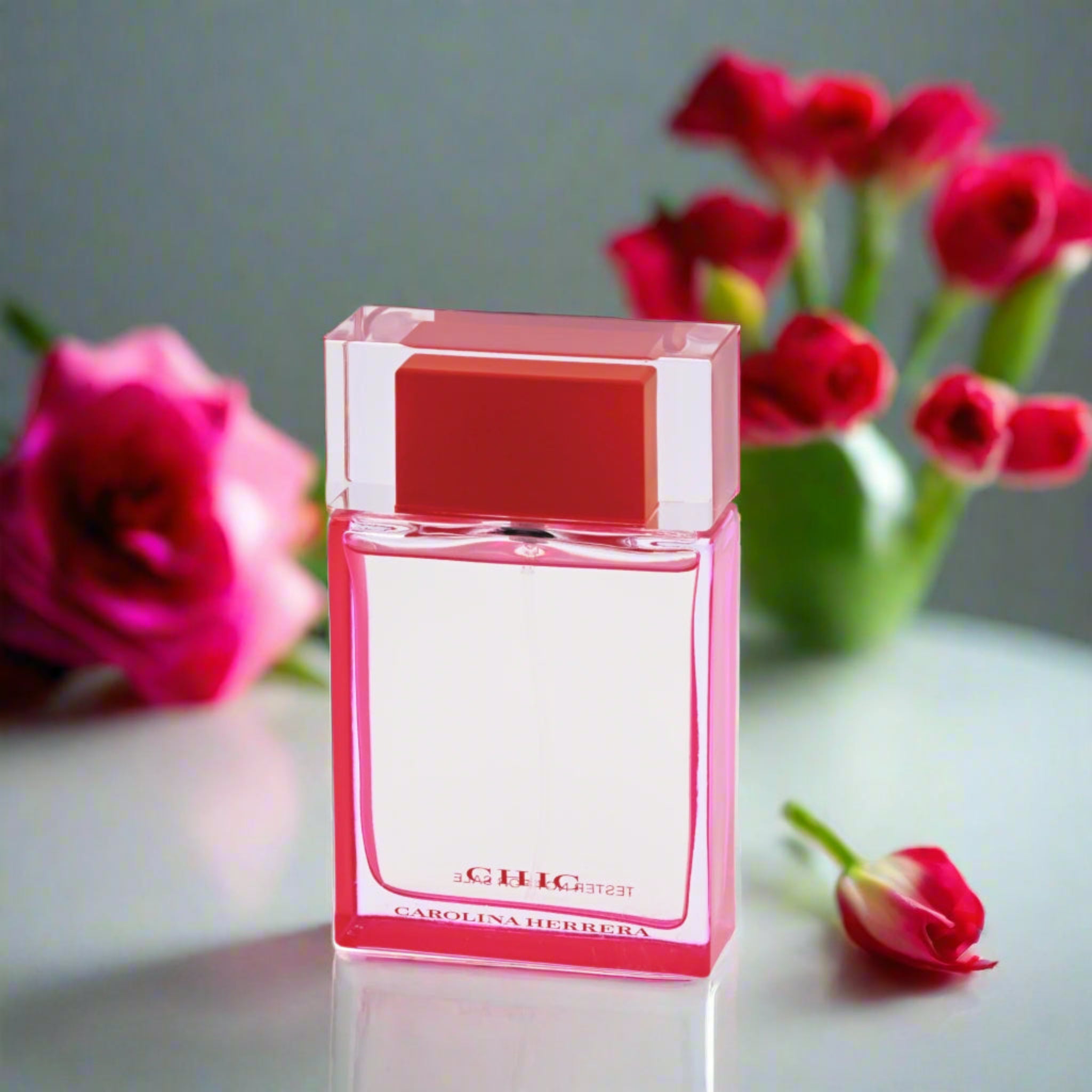 Pink and clear perfume bottle with 'Giuig' branding on a white background