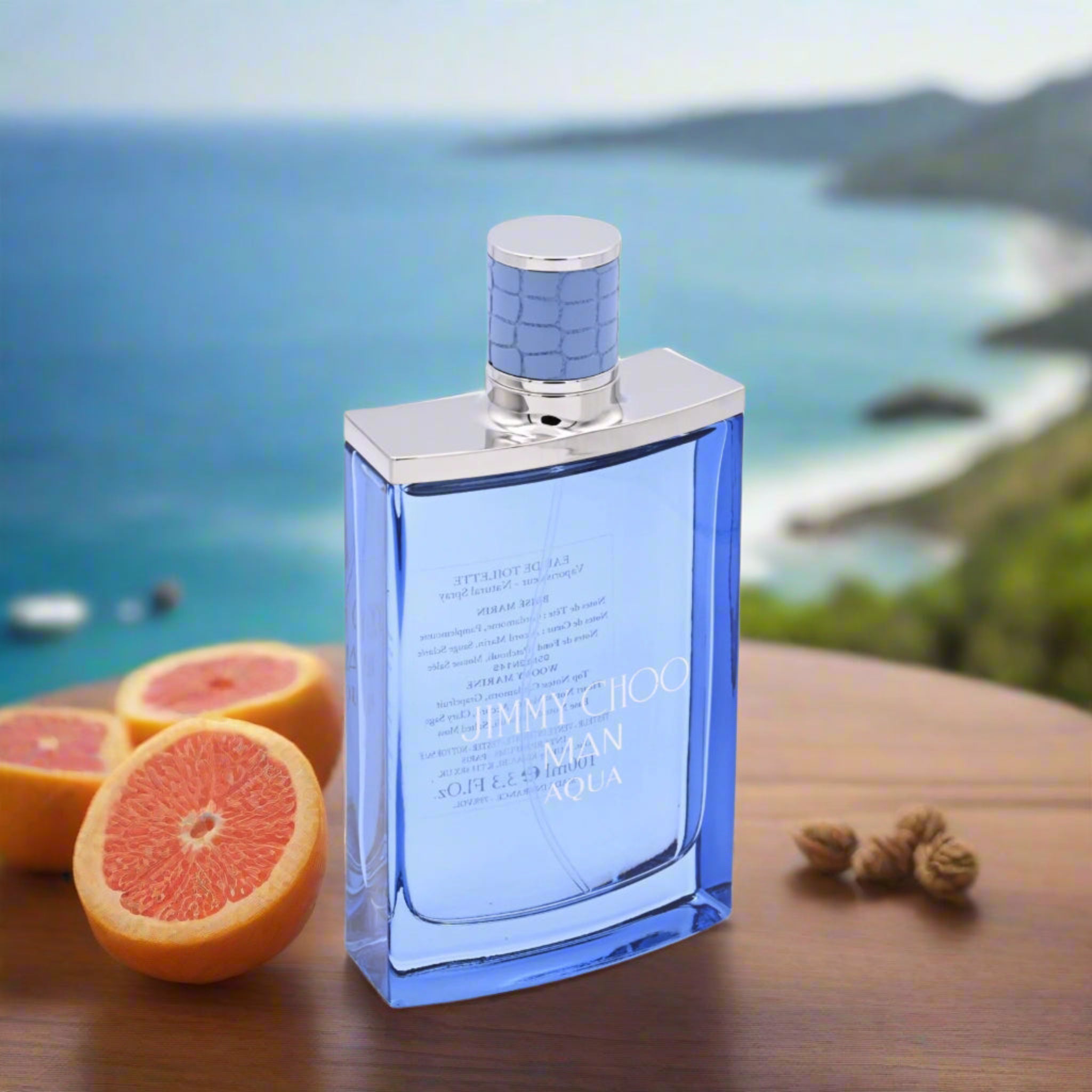 Blue perfume bottle with silver cap on a white background