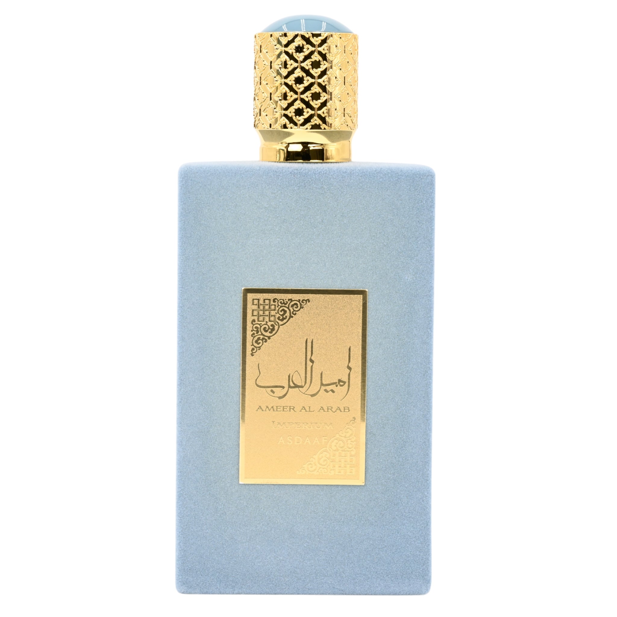 Perfume bottle with gold cap and label on a light blue background
