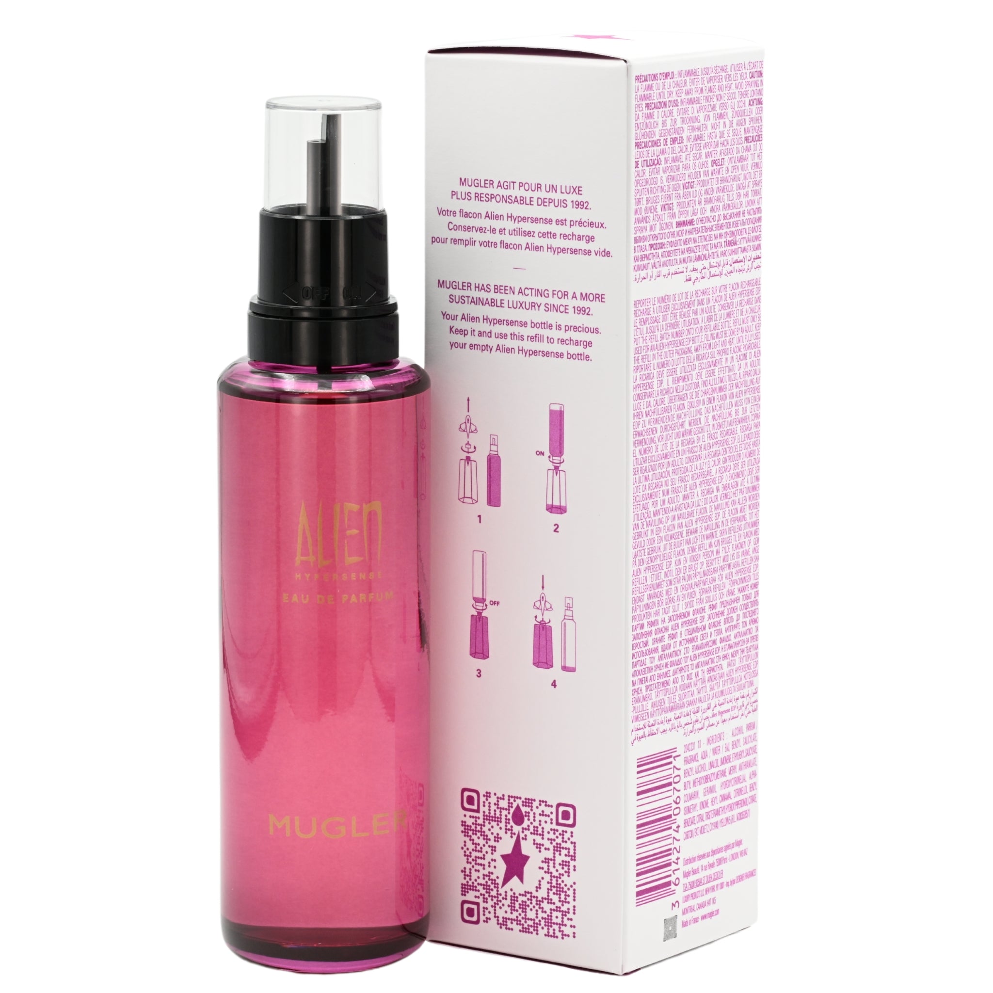 Pink perfume bottle with black cap next to its packaging on a white background