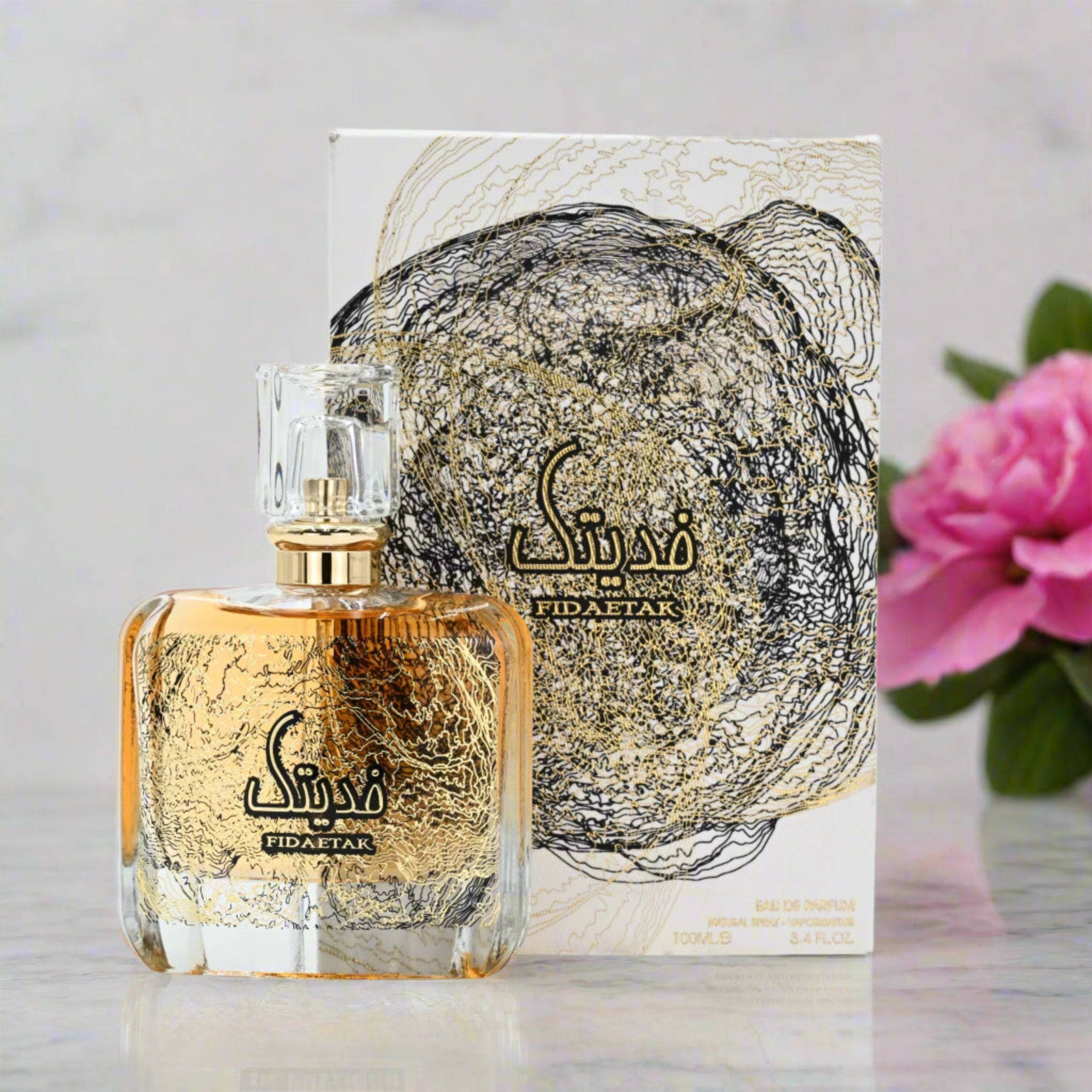 Perfume bottle and packaging with floral background