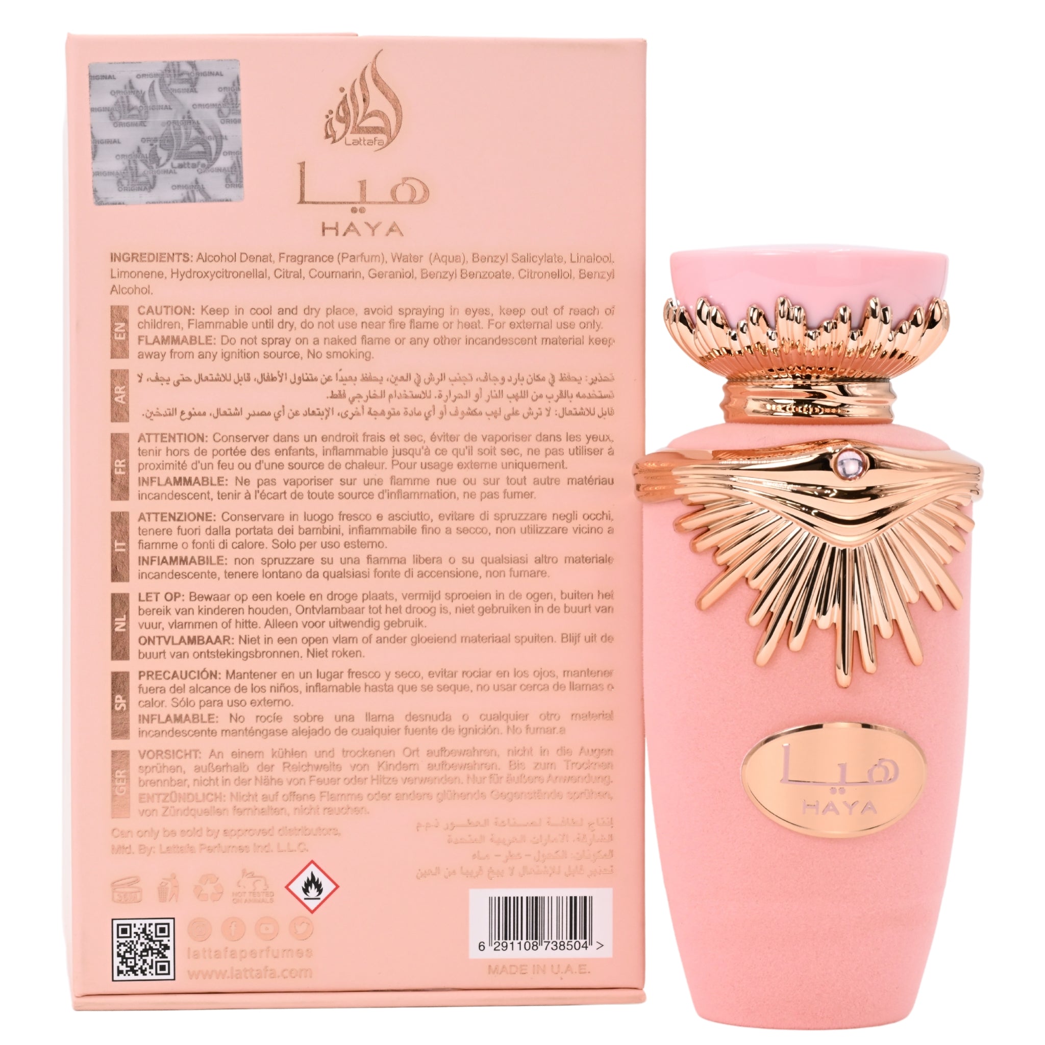 Pink Haya perfume bottle with gold accents next to its packaging on a white background