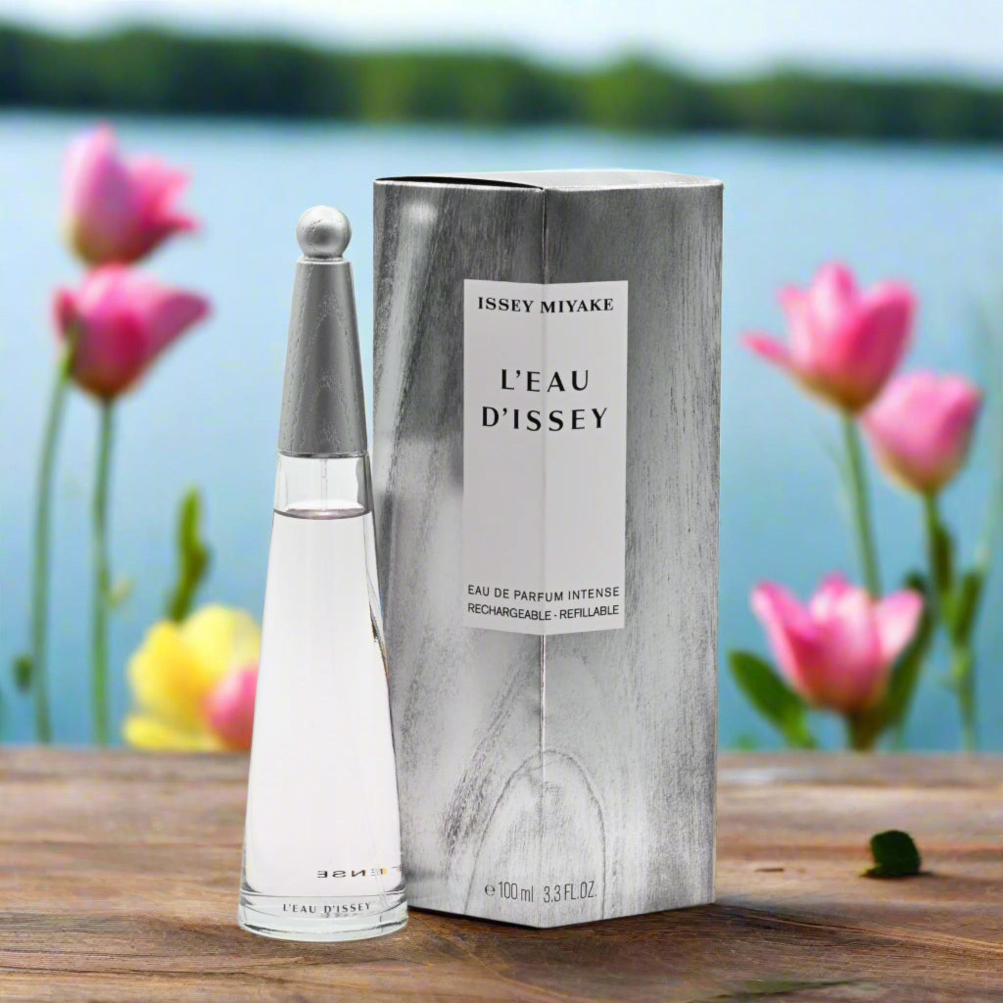 Issey Miyake L'Eau d'Issey perfume bottle and packaging with a scenic background