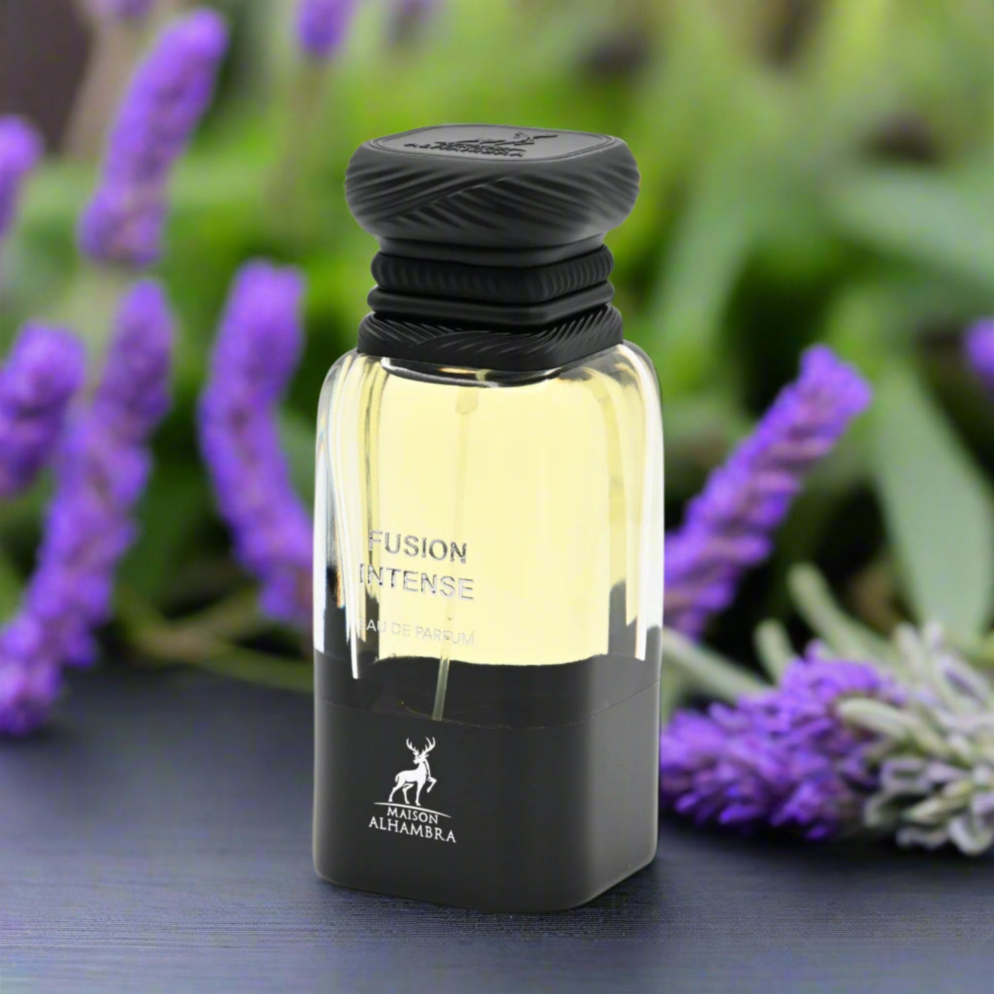 Perfume bottle labeled 'Fusion Intense' by Maison Arambia with lavender flowers in the background